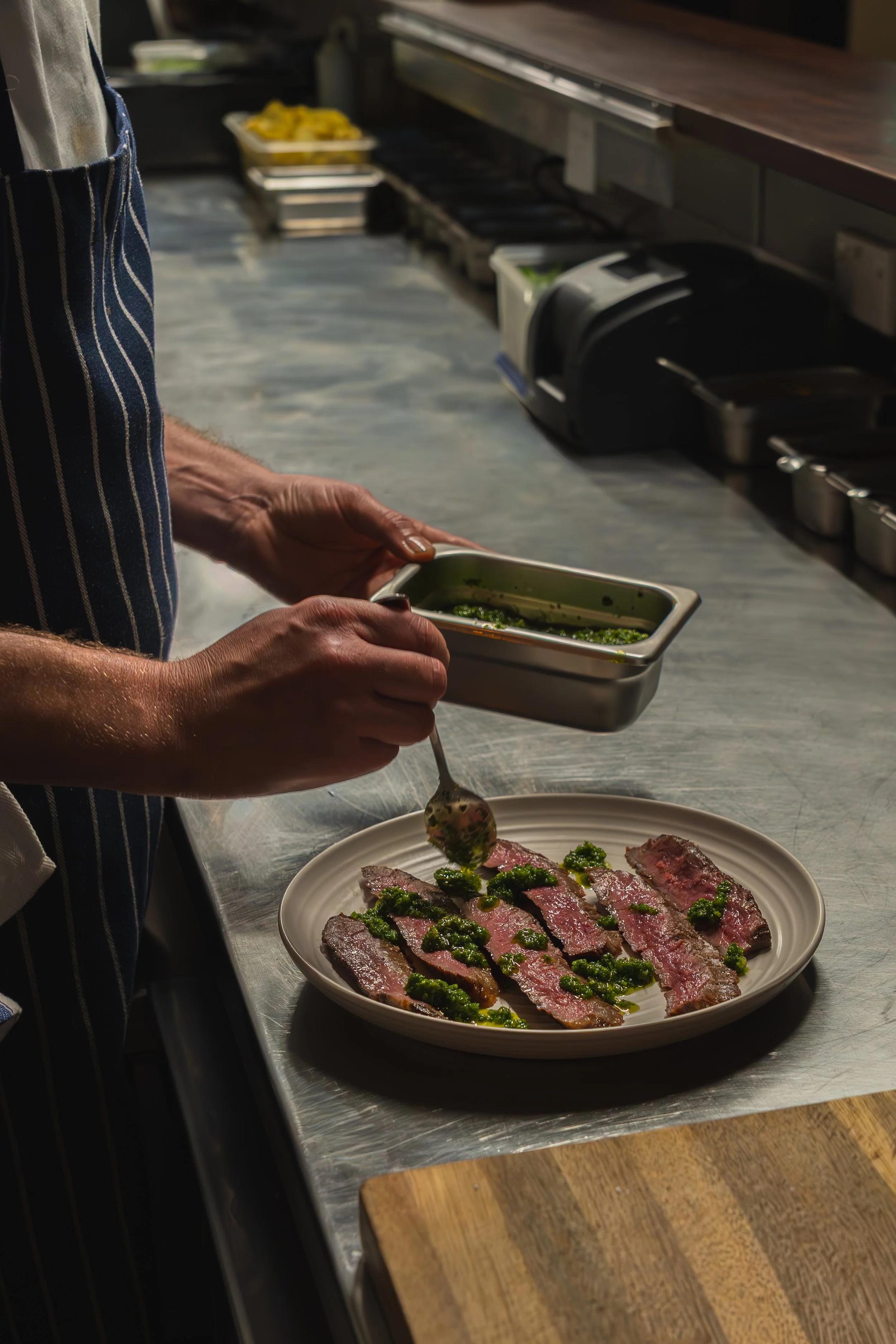 Chef preparing chargrilled flank steak
