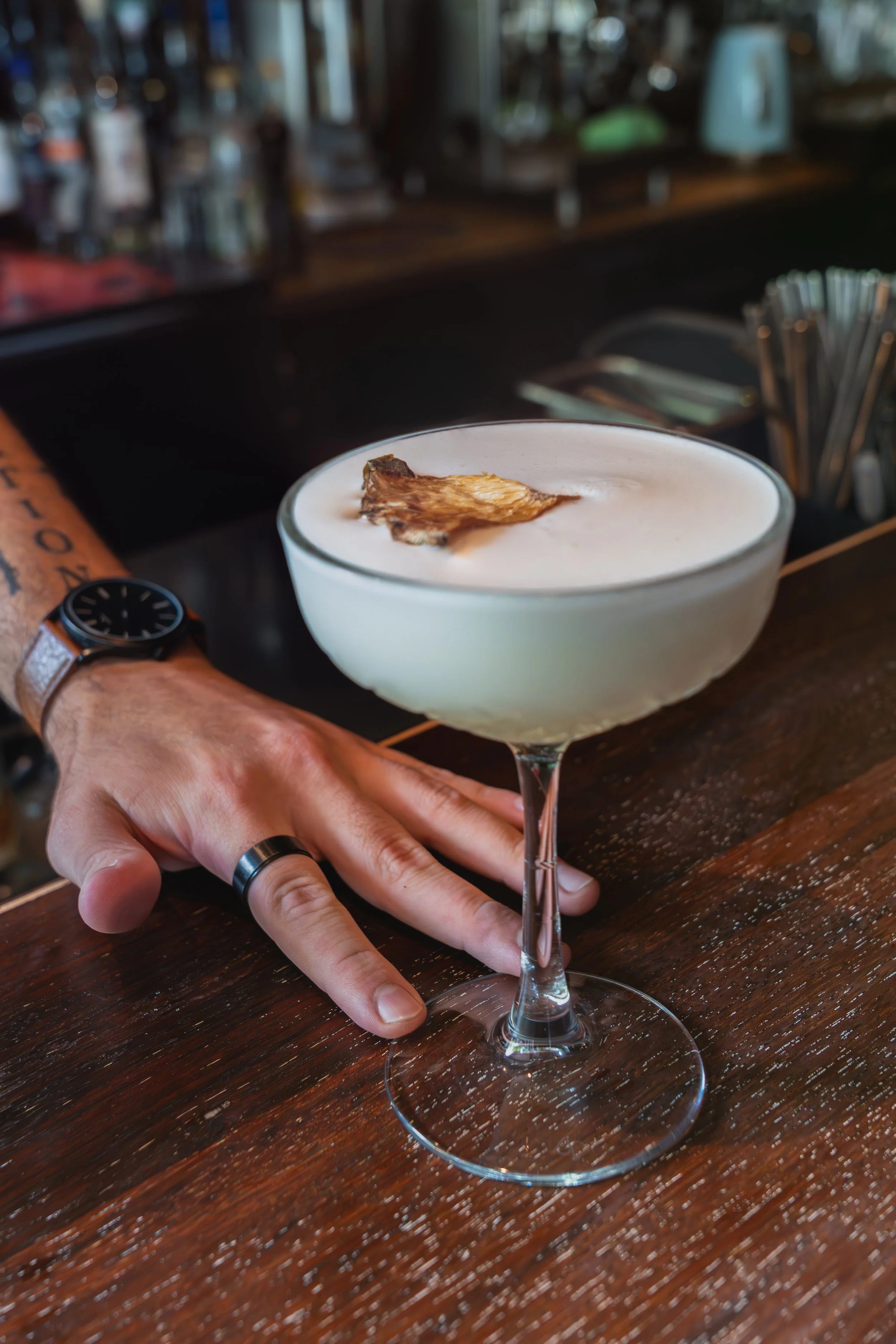 Coconut pineapple cocktail served with a dehydrated pineapple slice