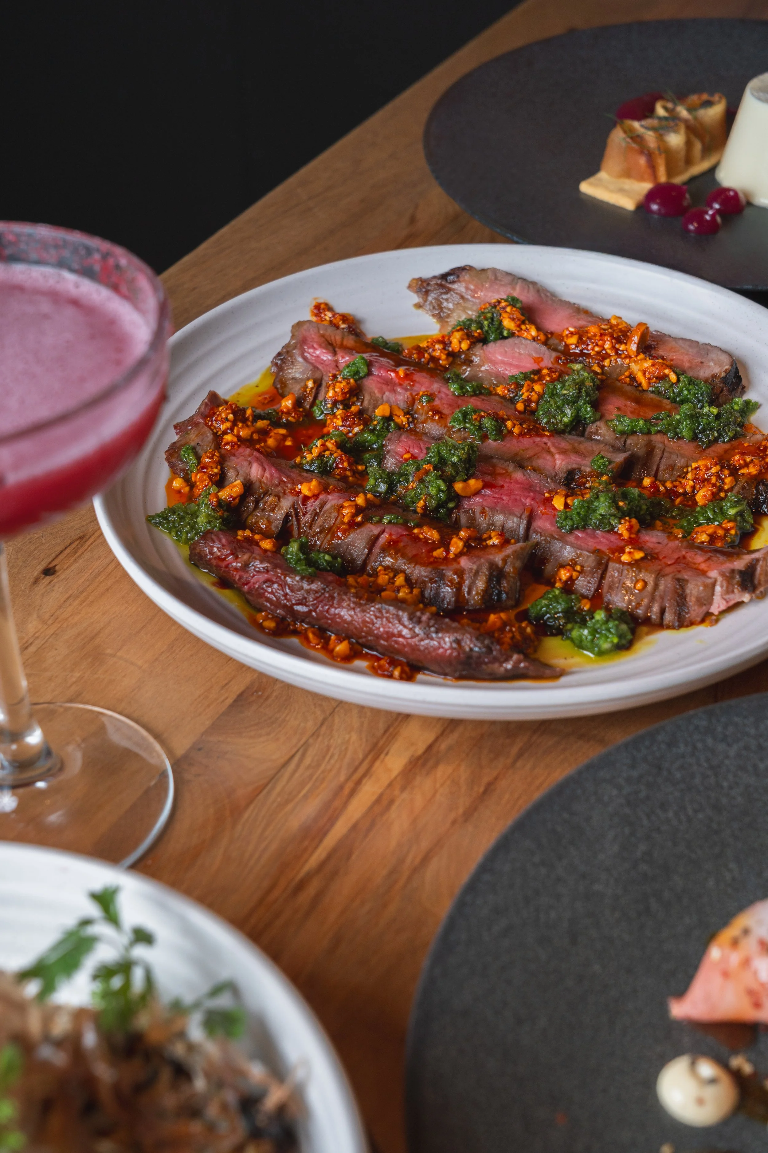 Chargrilled flank steak with peanut chili crisp and black vinegar
