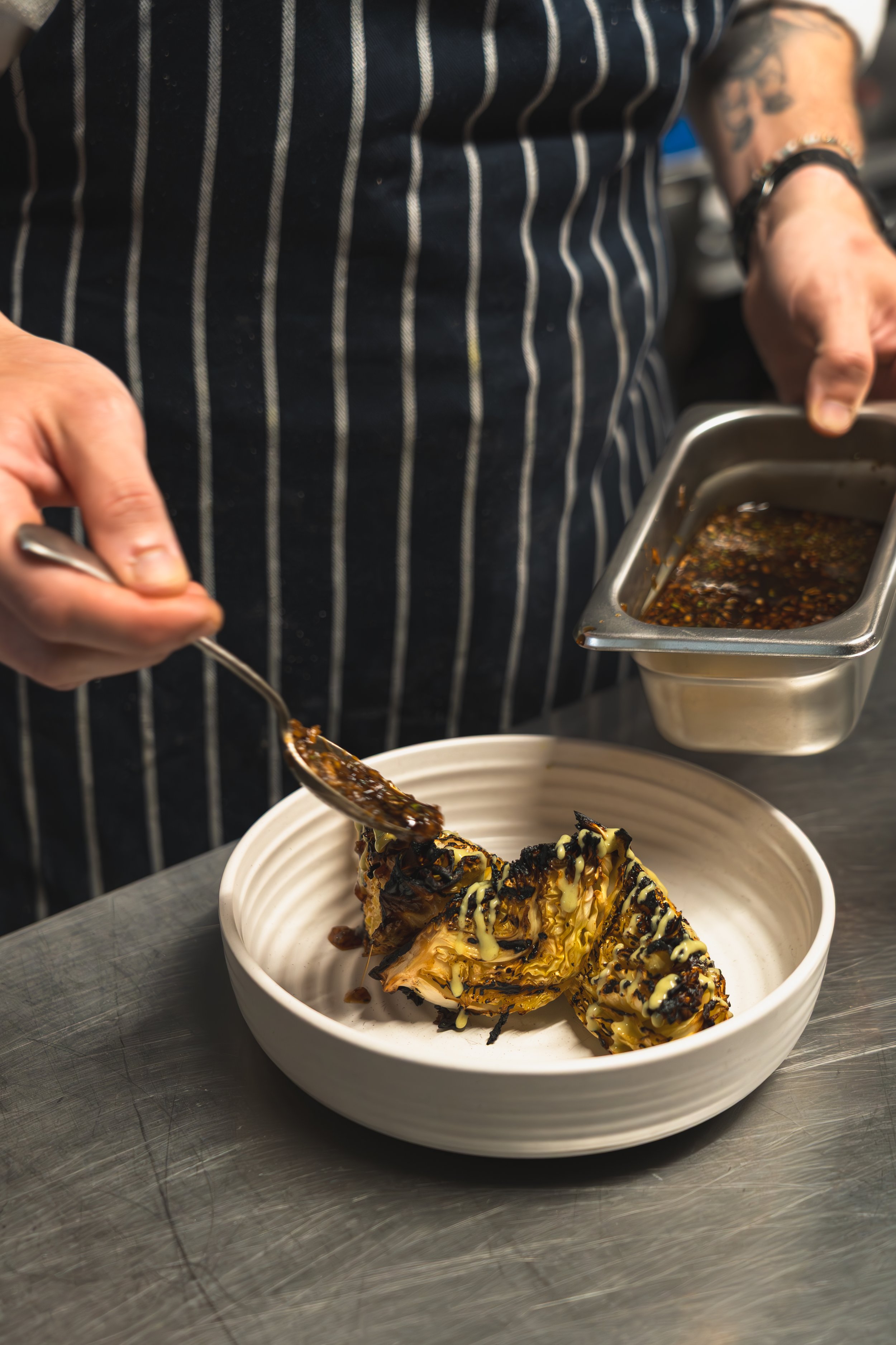 Chargrilled cabbaged served with difference sauces and bonito flakes