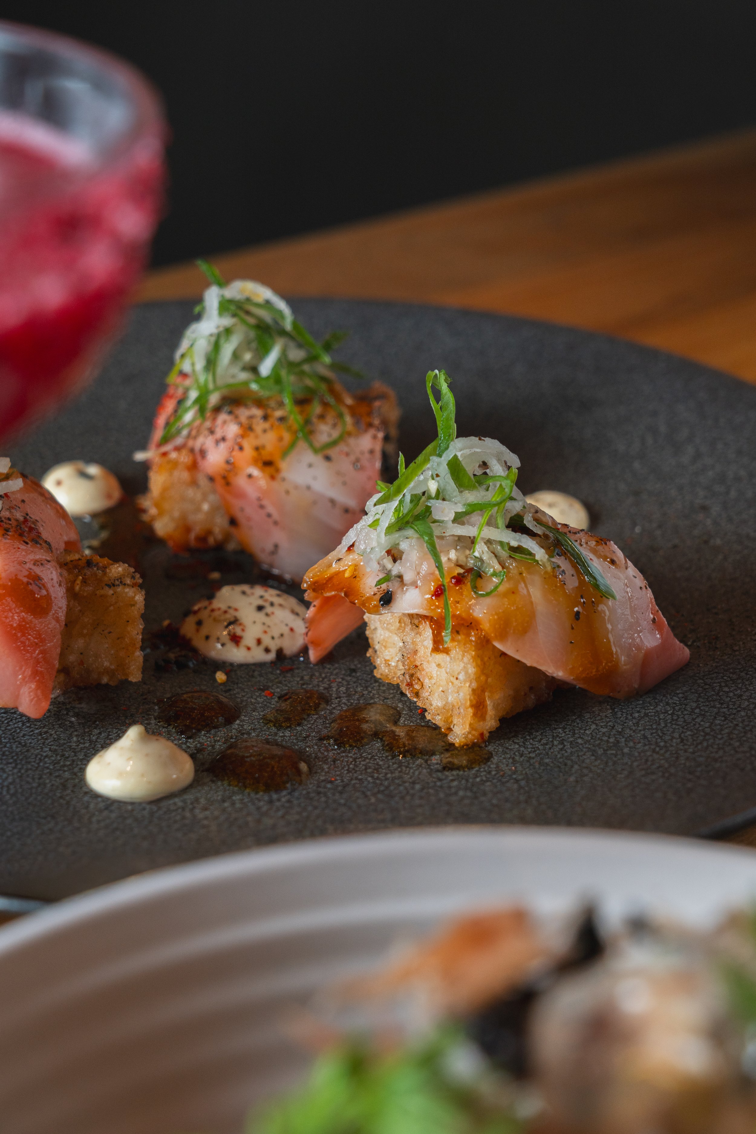 Nigiri salmon with crispy rice and agedashi glaze