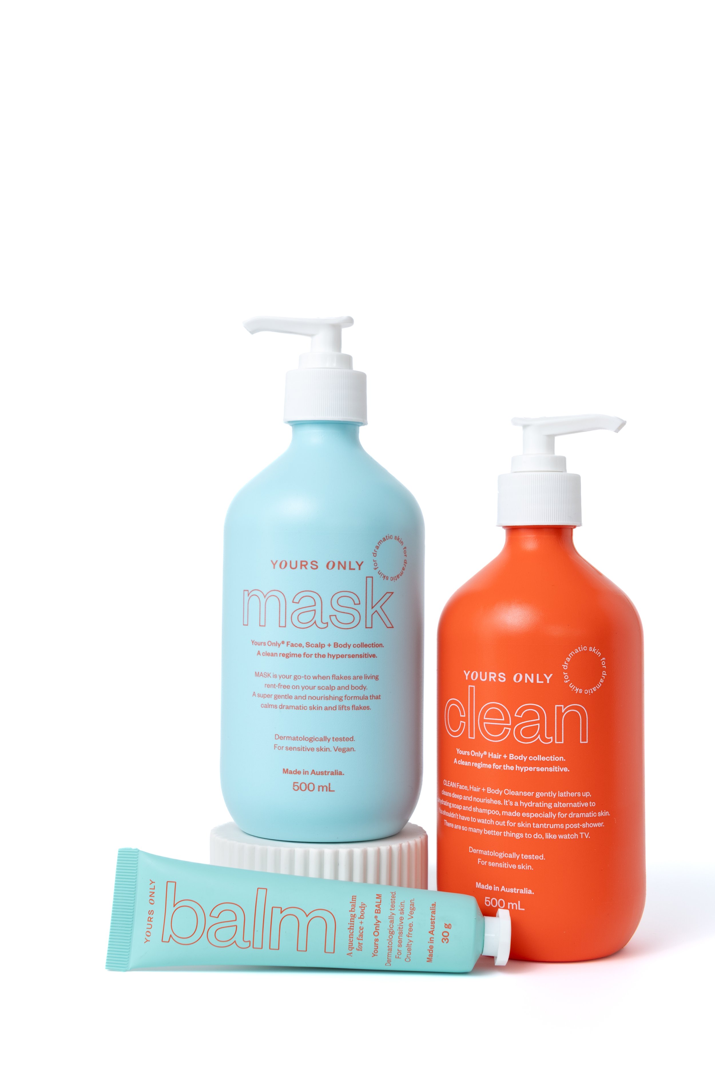 Three skincare products from Yours Only, including a blue mask bottle, an orange clean body wash, and a light blue balm tube, arranged against a white background.
