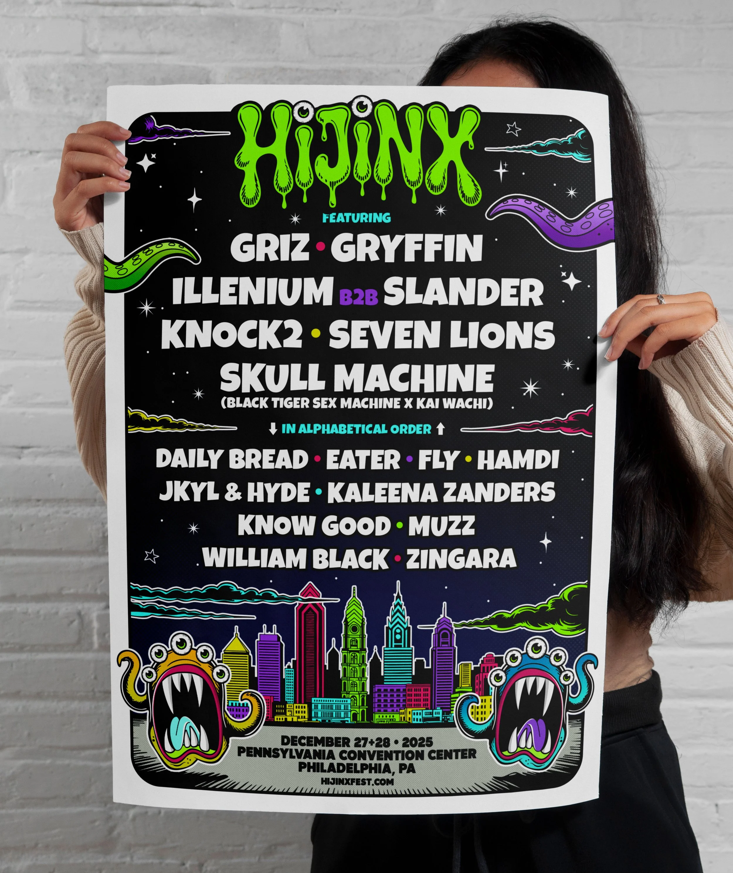A person holding a colorful event poster for Hijinx festival featuring musical acts like Griz, Gryffin, Illenium, Slander, Knock2, Seven Lions, Skull Machine, and others, with a city skyline and cartoon monsters in the background.
