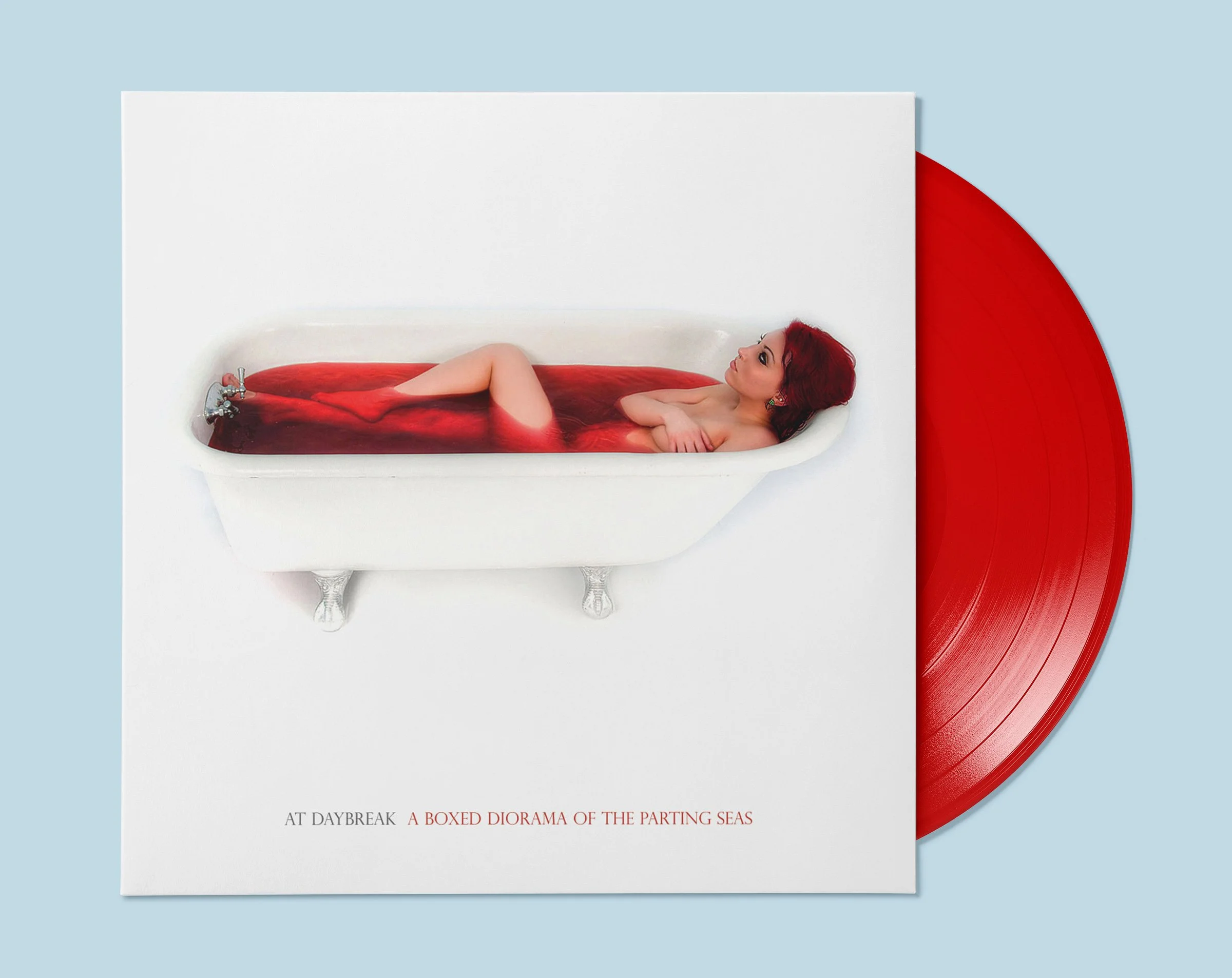 Album cover featuring a woman with red hair lying in a bathtub filled with red liquid, positioned on a white background with a red vinyl record partially visible behind it.