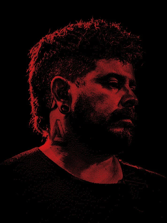 A stylized digital portrait of a man with a beard and short hair, rendered in red tones against a black background.