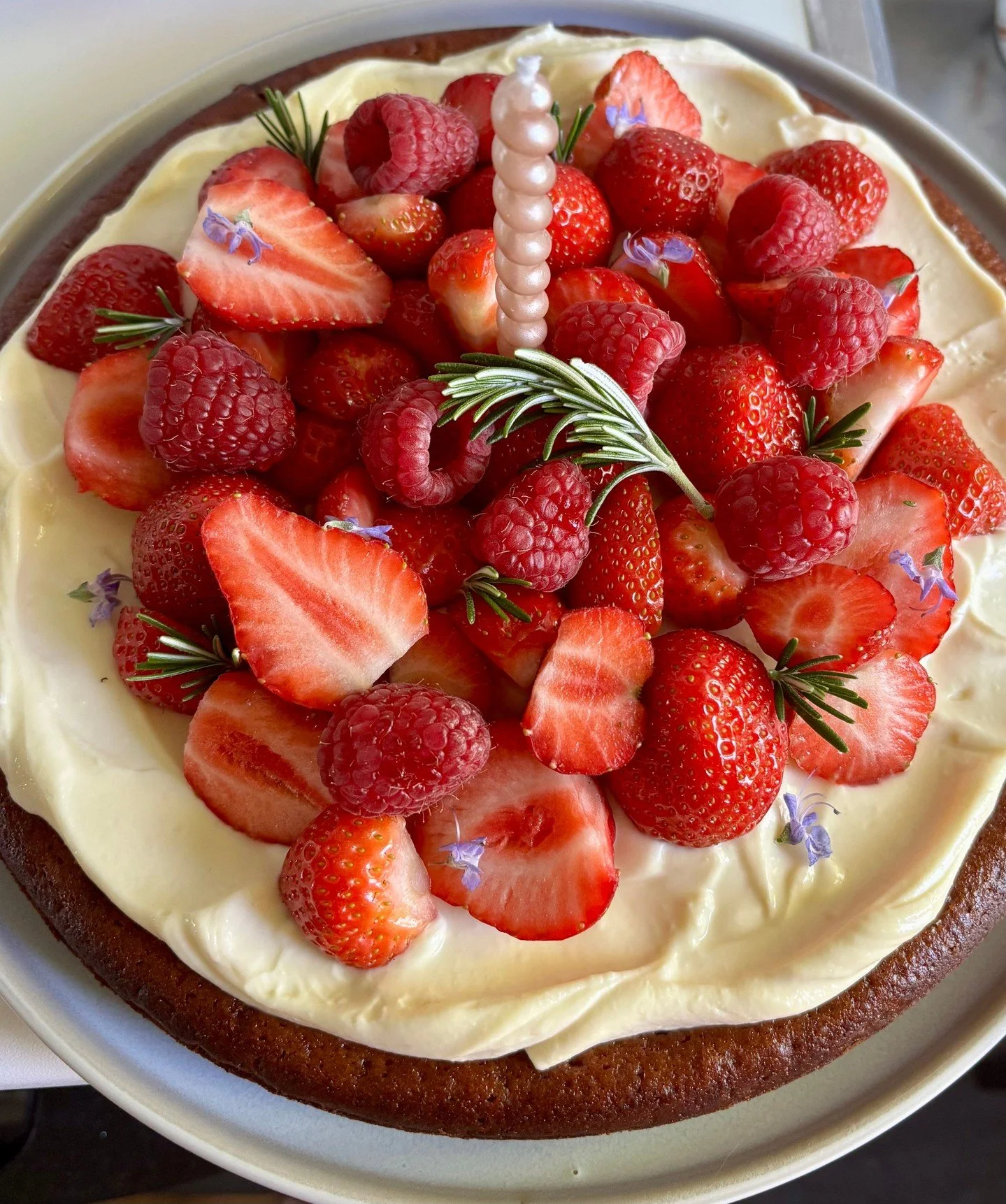 Olive Oil Cake Topped With Mascarpone and Berries 🍓 

It's a moist cake made with olive oil, then covered with mascarpone frosting, and topped with raspberries and strawberries.

Link to the recipe is in my bio 👆️ 

#oliveoilcake #birthdaycake #ber