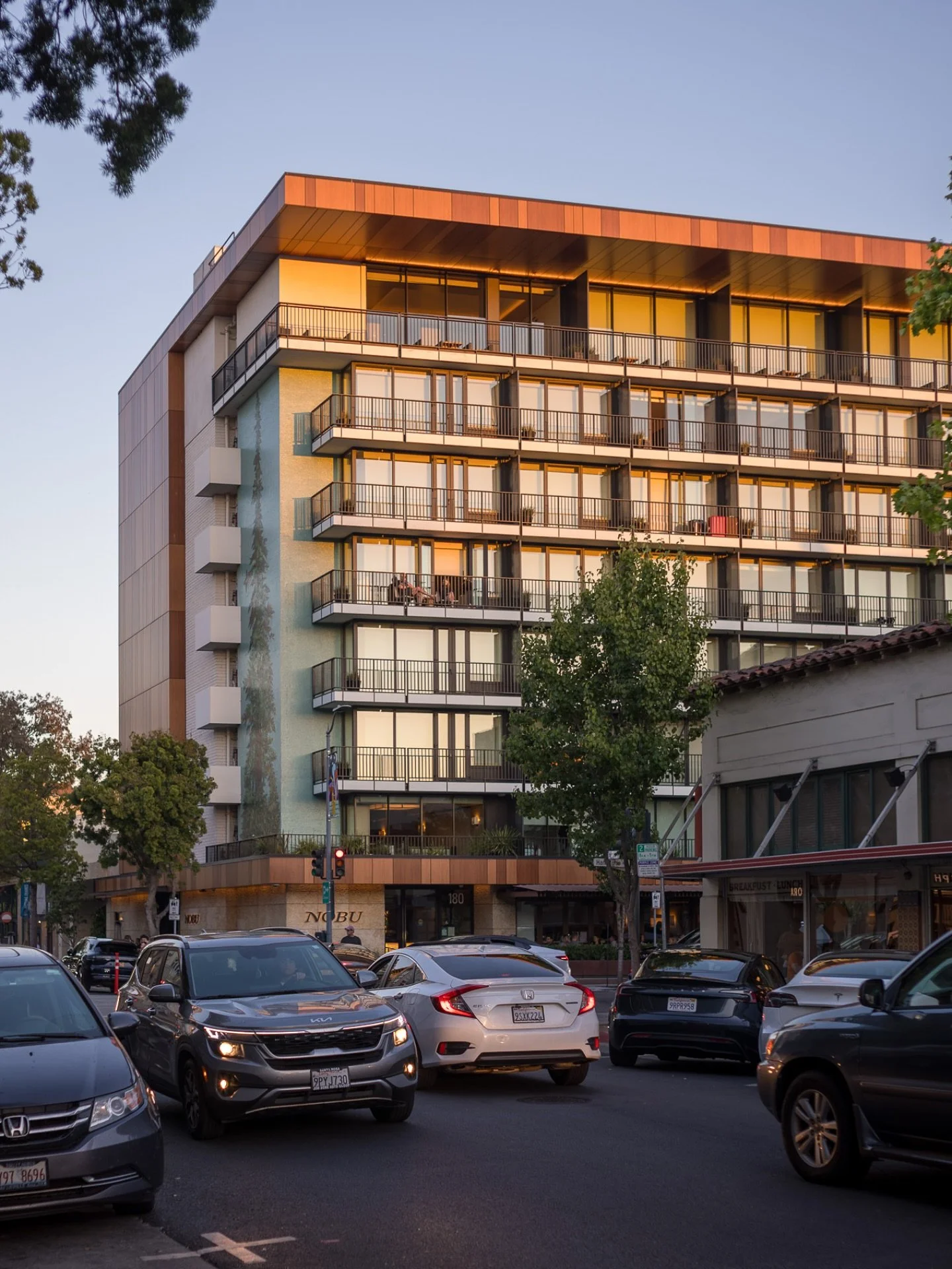 Golden hour in Palo Alto. #goldenhour #nobu #paloalto #downtown #leica #leicam11 #m11 #summicron #testshot #architecture #treemural #peninsulacreamery #paloaltocreamery #siliconvalley #bayarea #sunset #photography #leicasf #
