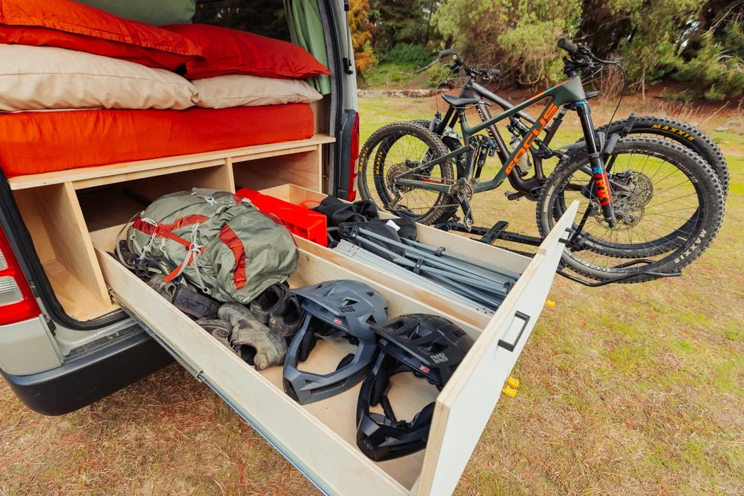 Campervan conversions for bikers, with gear storage and bike racks.