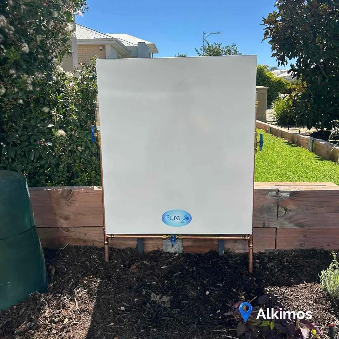 Pure₂O whole house water filtration system installed in Alkimos Perth with Surf Mist powder coated cover, providing premium 0.22 micron filtration for PFAS, chloramine and sediment reduction.