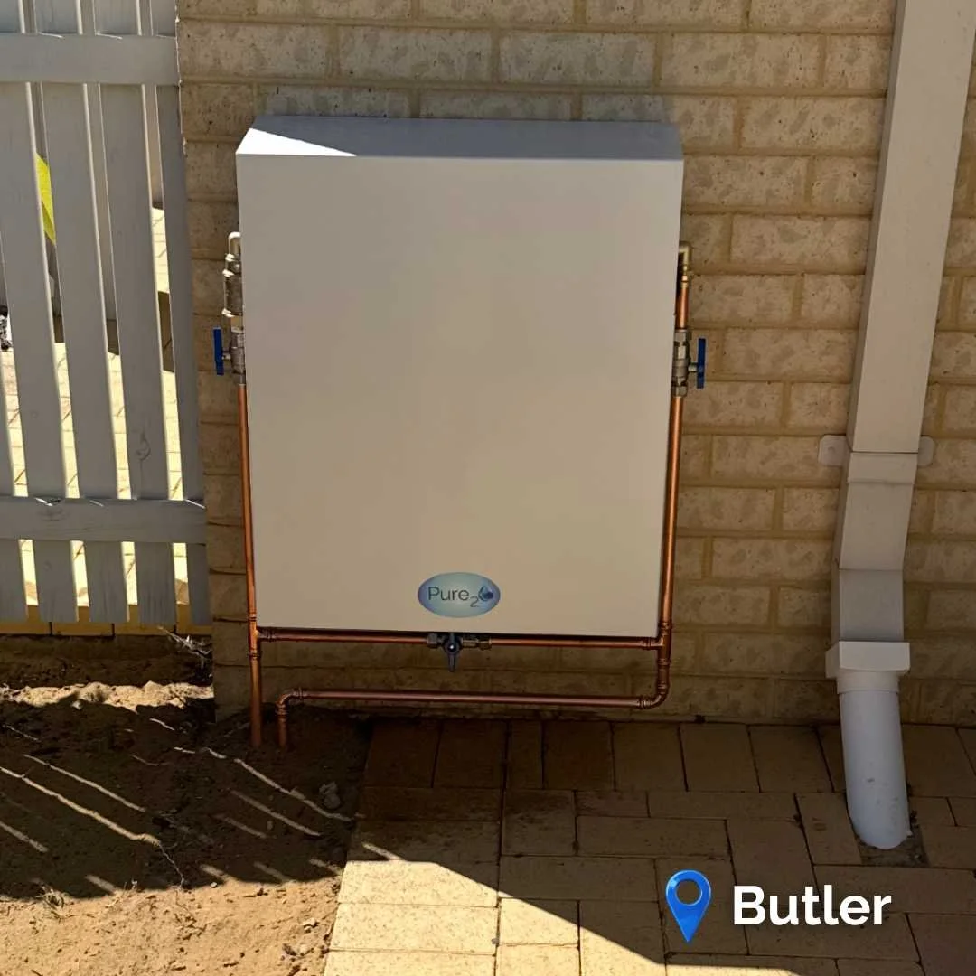 Pure₂O whole-house water filtration system installation in Butler WA with outdoor enclosure protecting premium 3-stage filtration system.