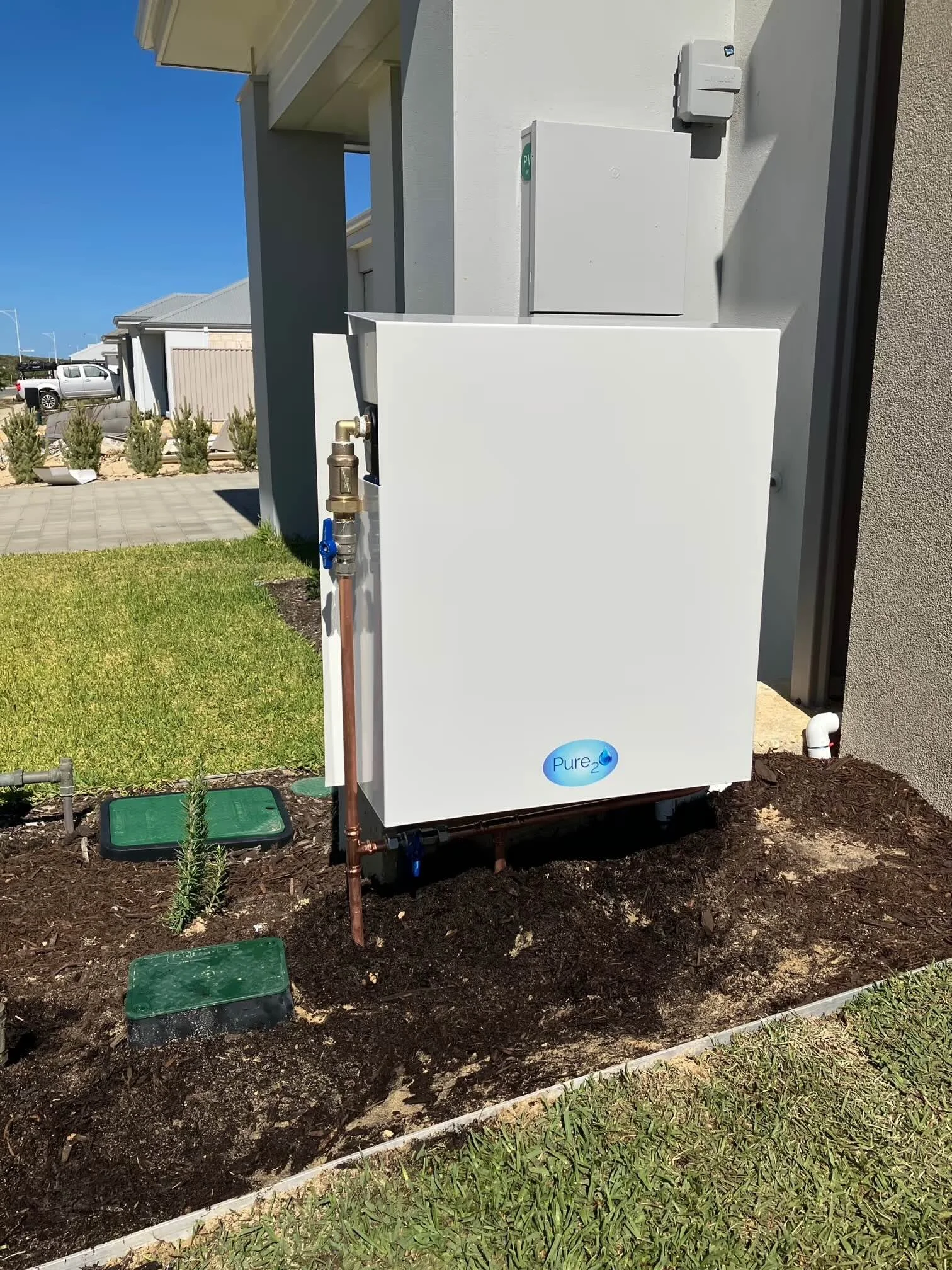 Pure₂O whole-home water filter system installed externally on Perth residential property, protecting household water supply from chlorine, PFAS and other contaminants.
