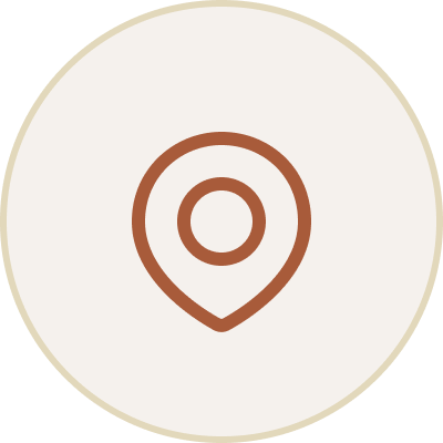 Icon of a map pin within a circular border.