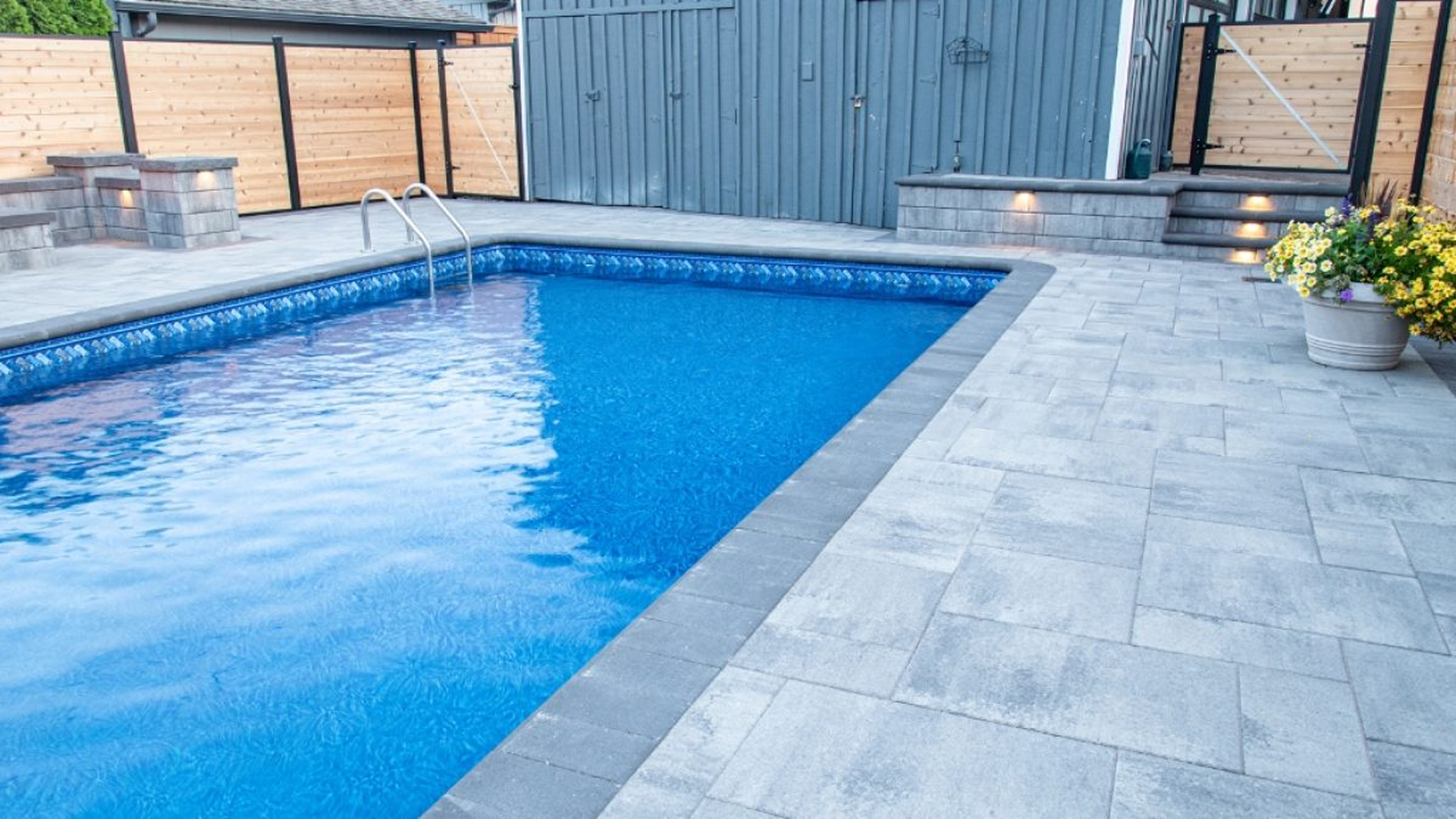Brick pavers around a pool in backyard