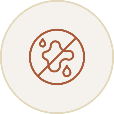 Icon of a puzzle piece with drops of water and a slash through it, indicating no allergies or irritants.
