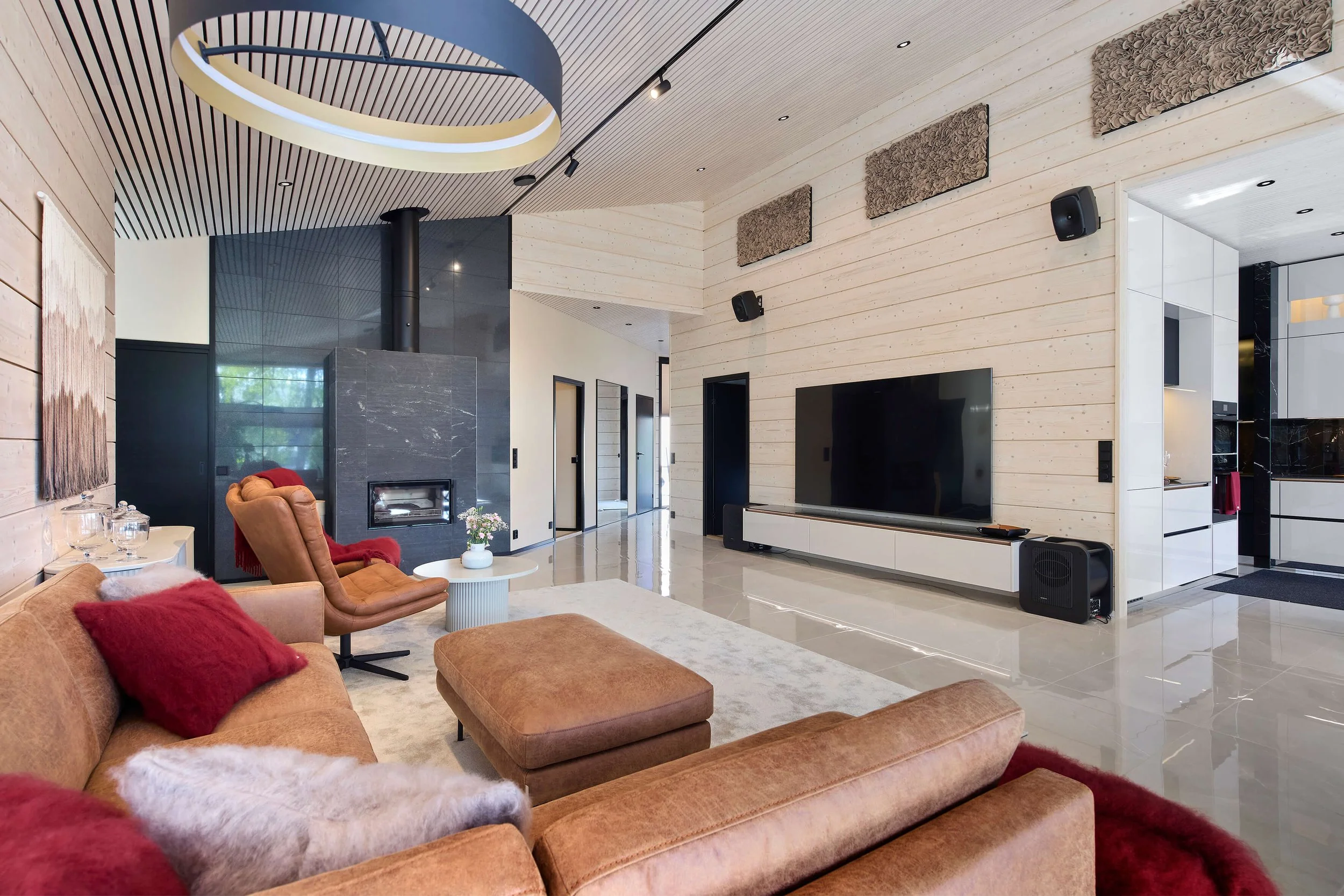 villa-sydan-design-log-cabin-living-room-fireplace-tv-wall.jpg