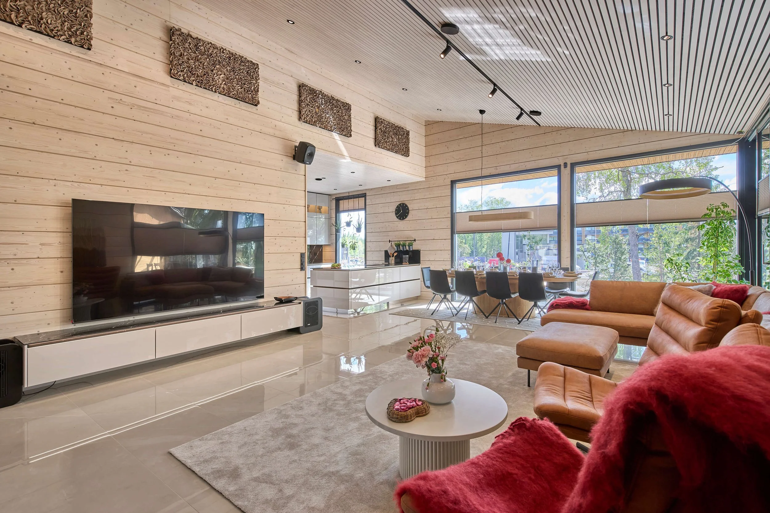 cottage-heart-log-house-living-room-dining-area-large-windows.jpg