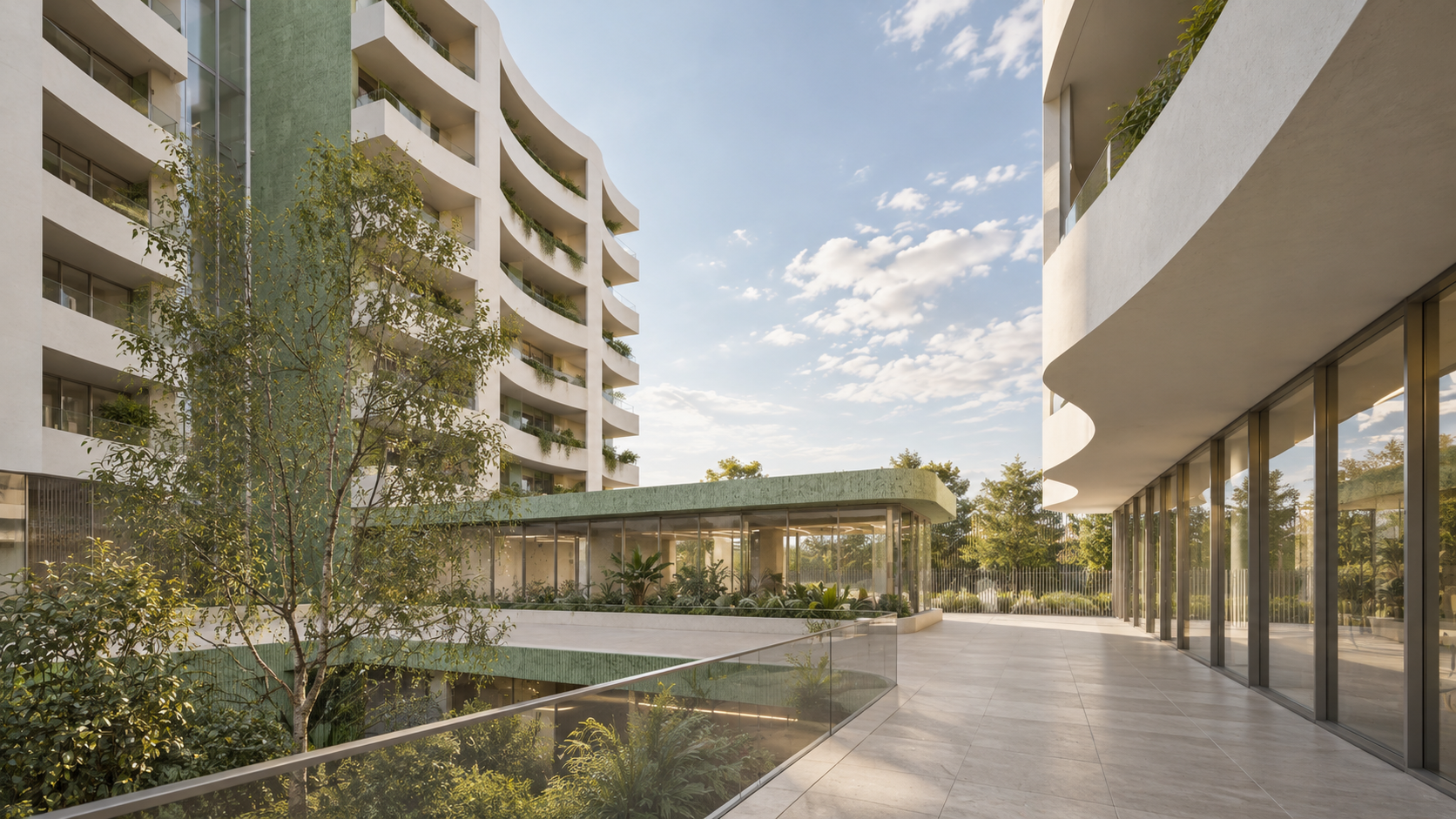 Modern apartment building with curved balconies, trees, and a landscaped courtyard, under a partly cloudy sky.