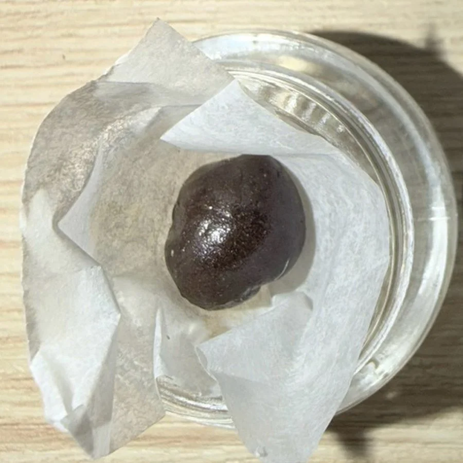 Static hash — a pressed ball of static sift in a glass jar