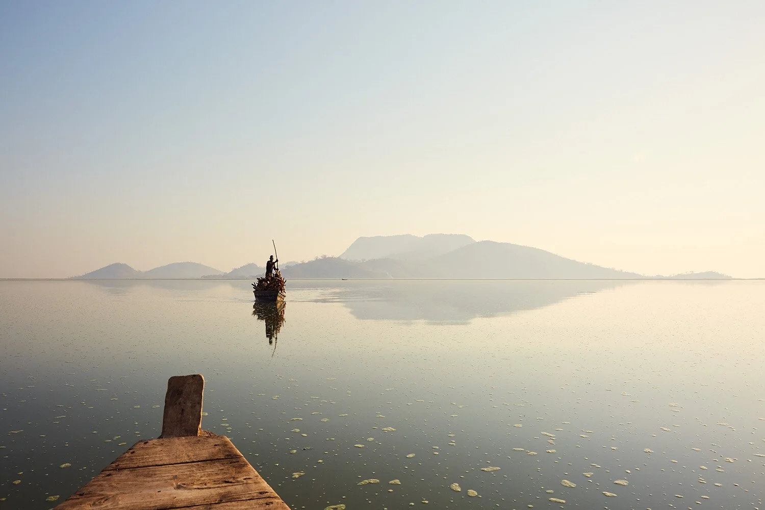 Boats slowly make their way across Lake Chilwa towards Chisi Island.
