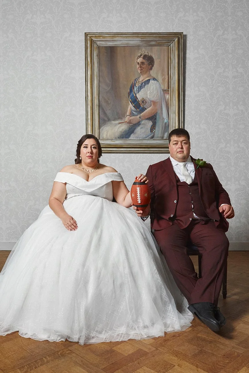 Newlyweds Michelle, a center for the Amsterdam Cats, and Barry, her offensive line coach, sit for a wedding portrait, Queens Room, Fletcher Hotel, Leeuwarden, NL, 2021. Michelle and Barry met on the field in 2017 and have been together since 2018.