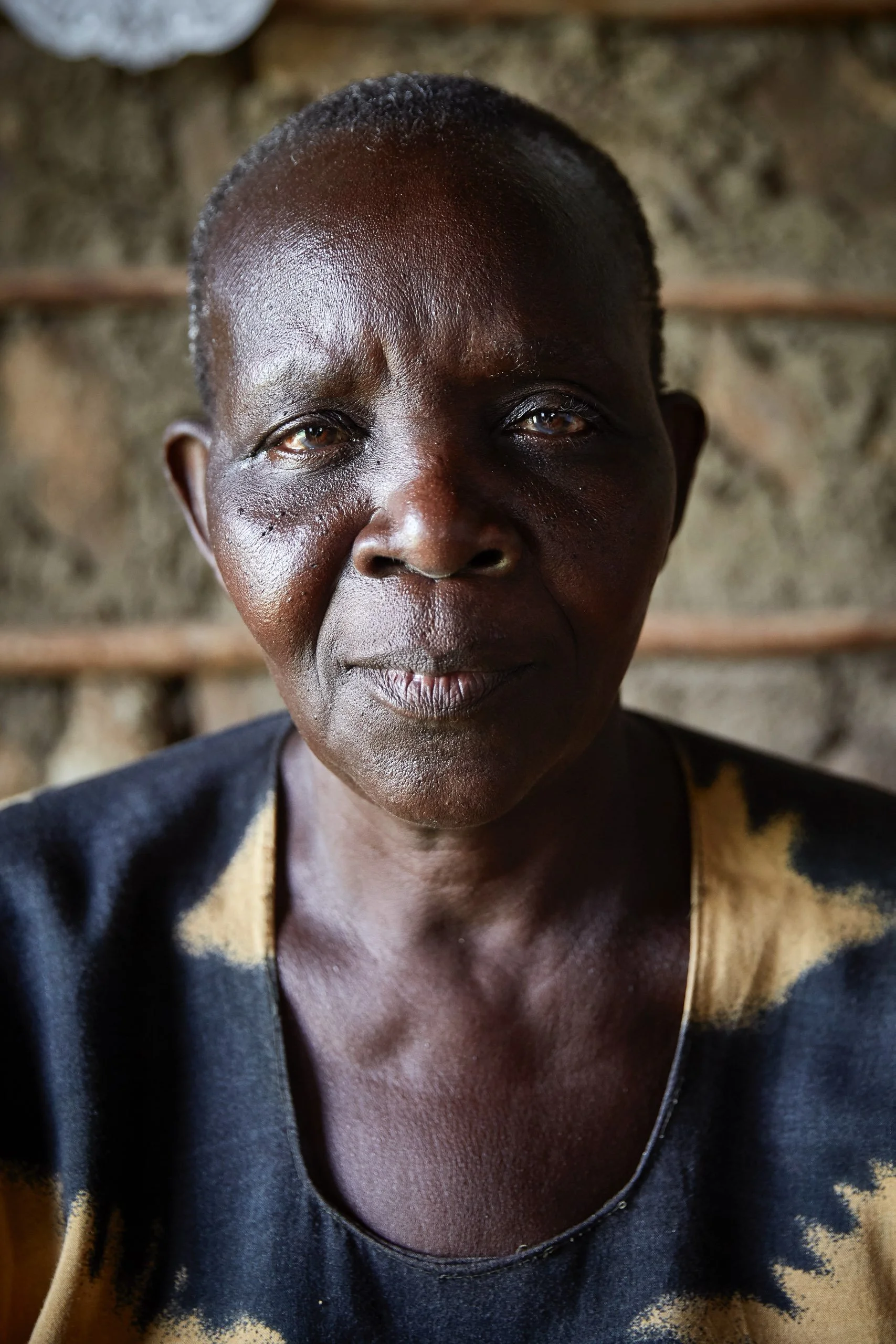 Justine, photographed at her house, Nduru beach, Kisumu, Kenya, 2019.