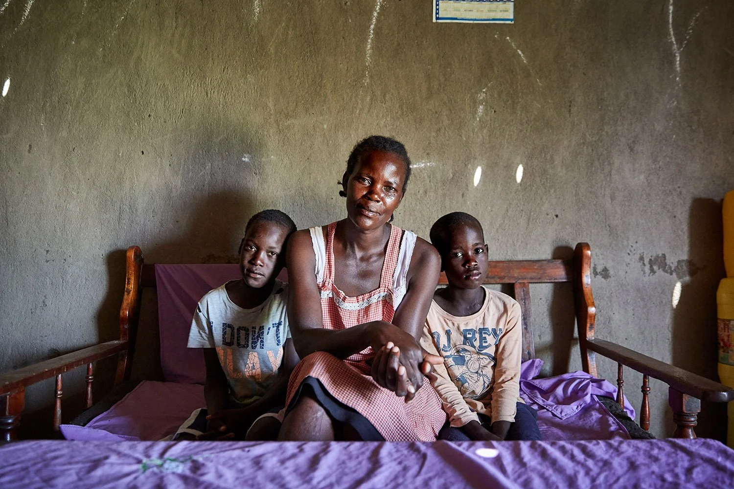 Naomy with two of her children at home, Nduru beach, Kisumu, Kenya, 2019.
When Naomy's boat was grounded, she says, "I was very discouraged. Because the money I was getting ... I was using to pay for my firstborn's school fees."
