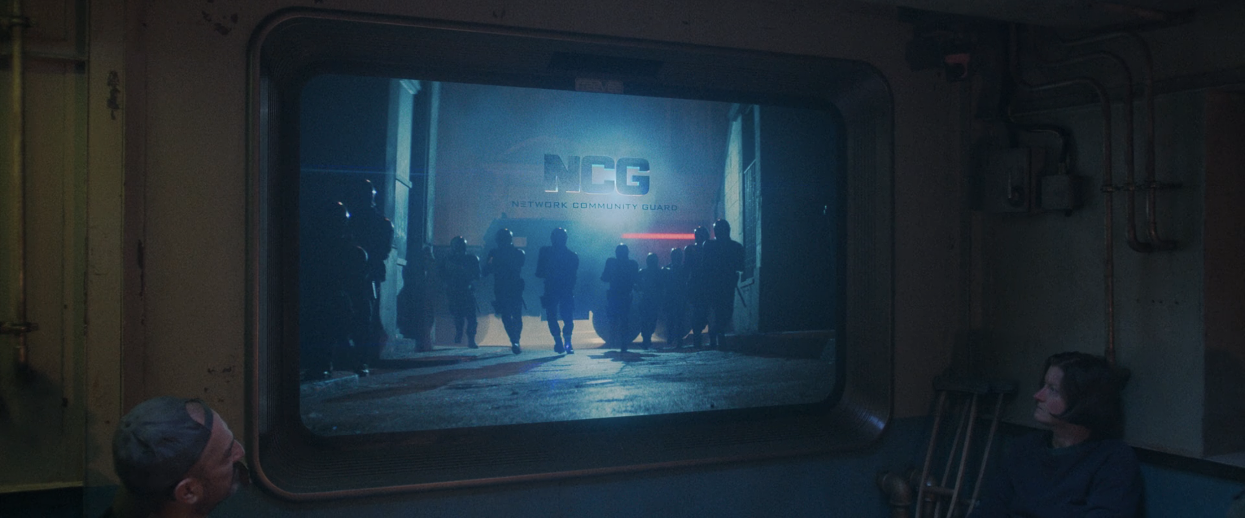 Network Community Guard – Logo used through out film, on costume and set decoration elements. 