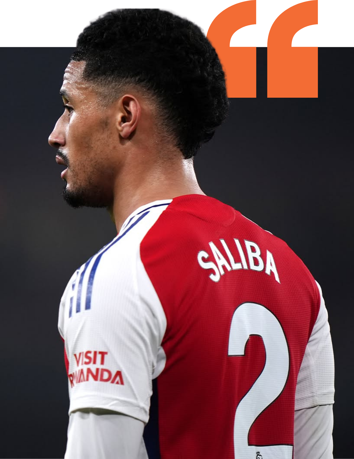 Side view of a soccer player wearing a red and white jersey with 'SALIBA' and the number 2 on the back.
