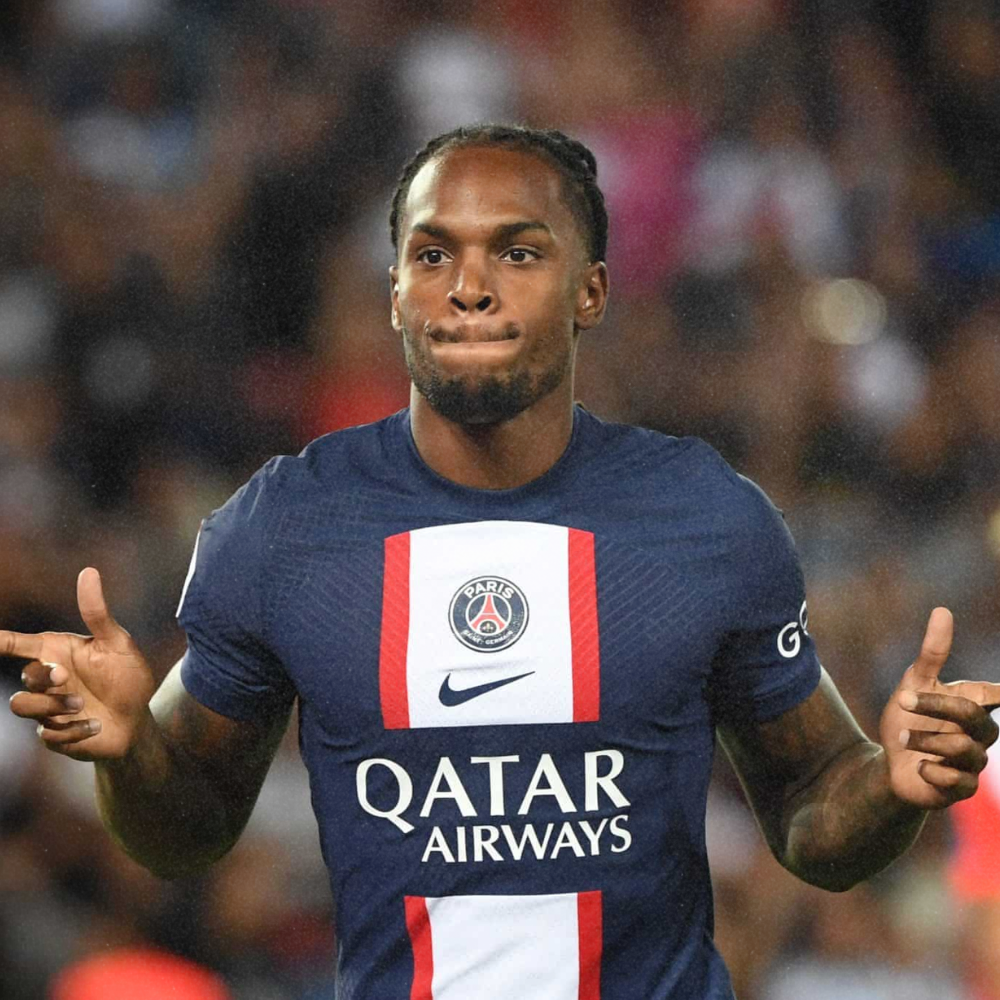 A professional soccer player celebrating on the field. He is wearing a Paris Saint-Germain jersey with Qatar Airways sponsorship.
