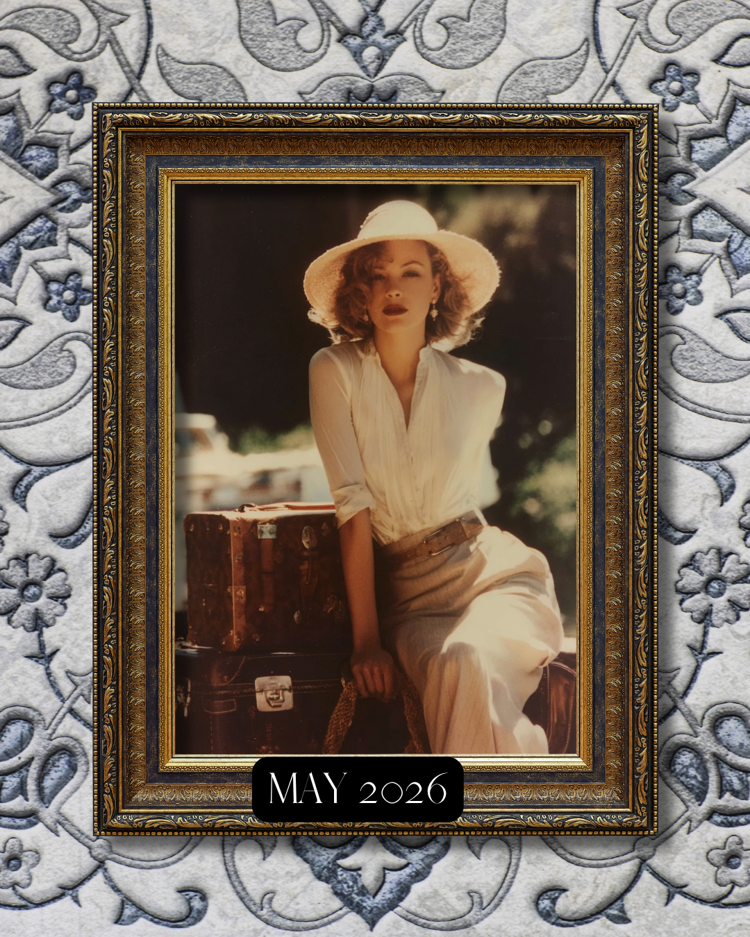 A framed vintage-style photograph of a woman sitting outdoors with two suitcases, wearing a wide-brimmed hat and light-colored clothing, with a label indicating May 2026 at the bottom.