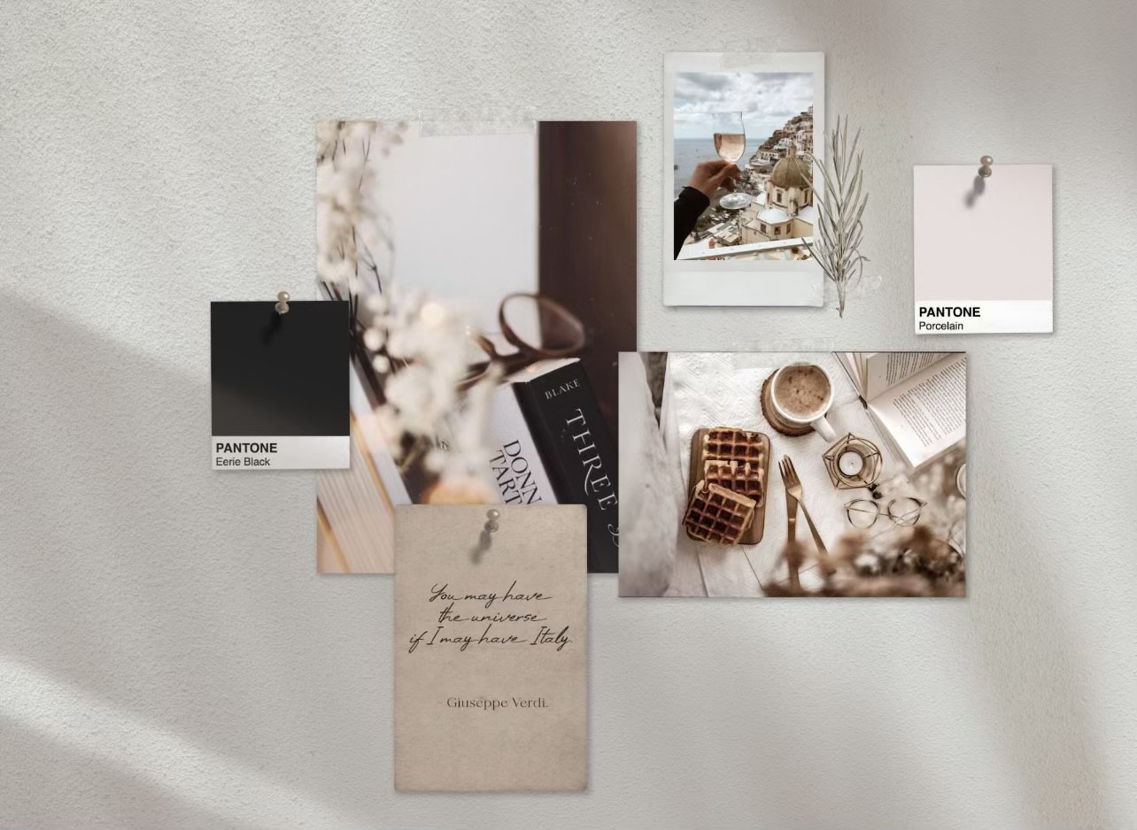 A wall with a collage of photos, notes, and color swatches, including a Polaroid of a person holding a wine glass, a picture of a breakfast with waffles and coffee, a handwritten note, and color samples labeled 'Eerie Black' and 'Porcelain'.