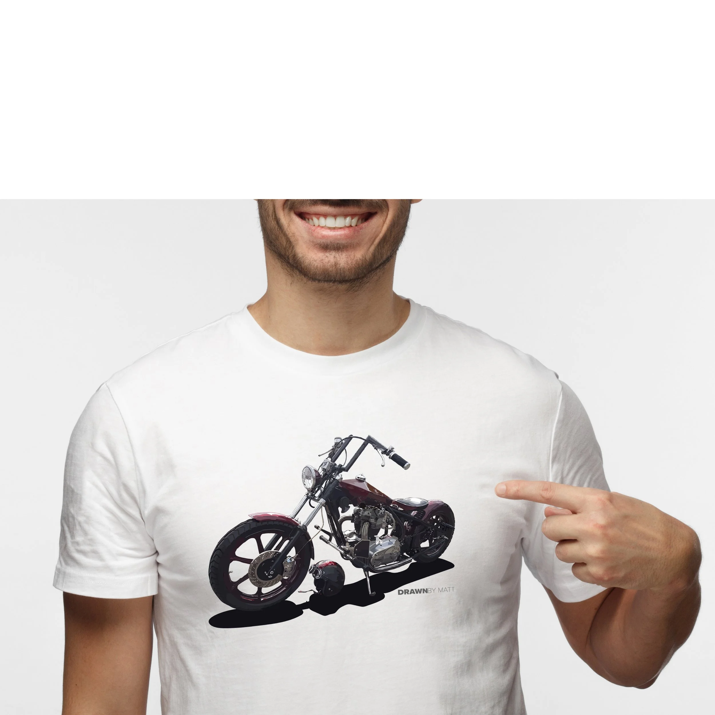 Person wearing a white t-shirt with a graphic of a motorcycle, smiling and pointing at the graphic.