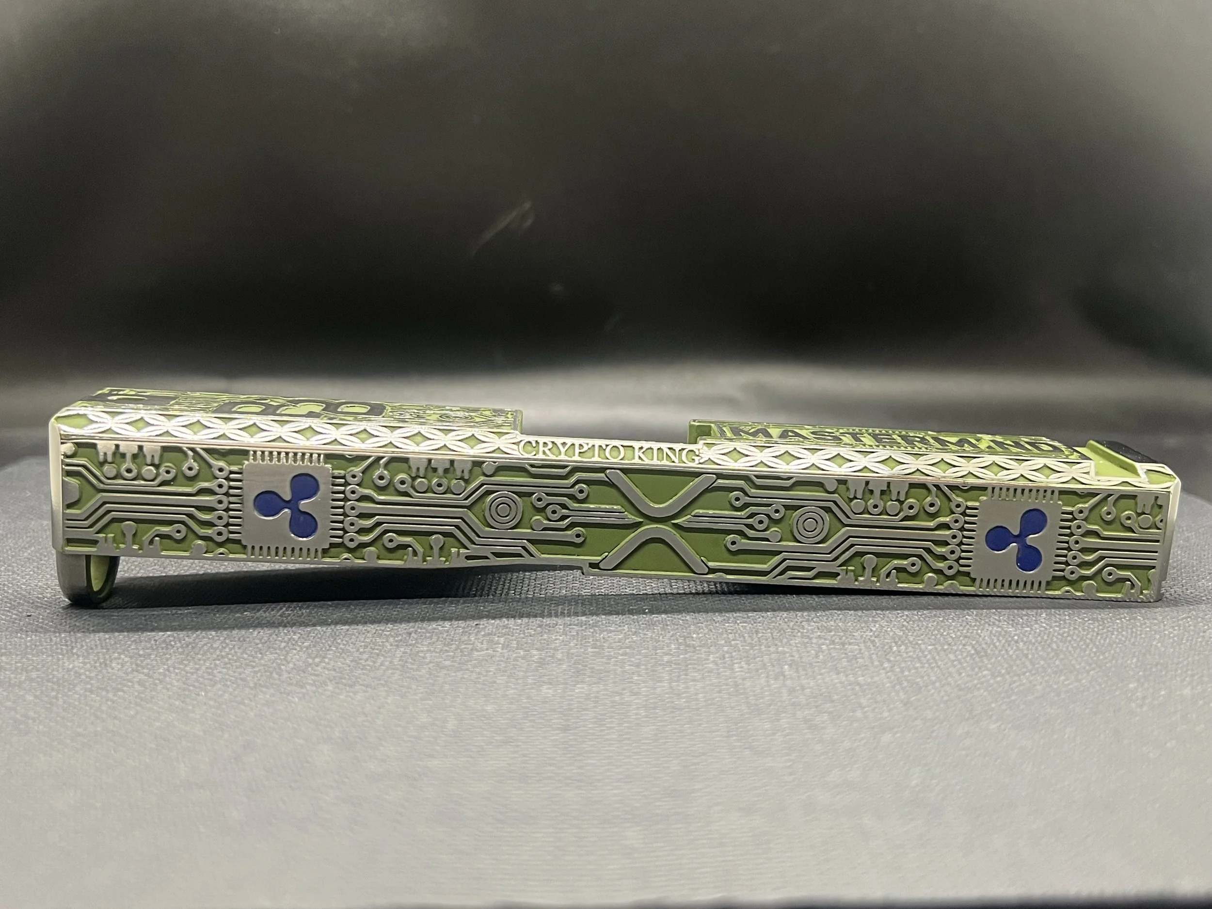 Custom Glock® 17 Gen 5, Ripple XRP themed, slide with circuit-style engraving and green Cerakote finish, designed, laser engraved, and custom finished for a client project.