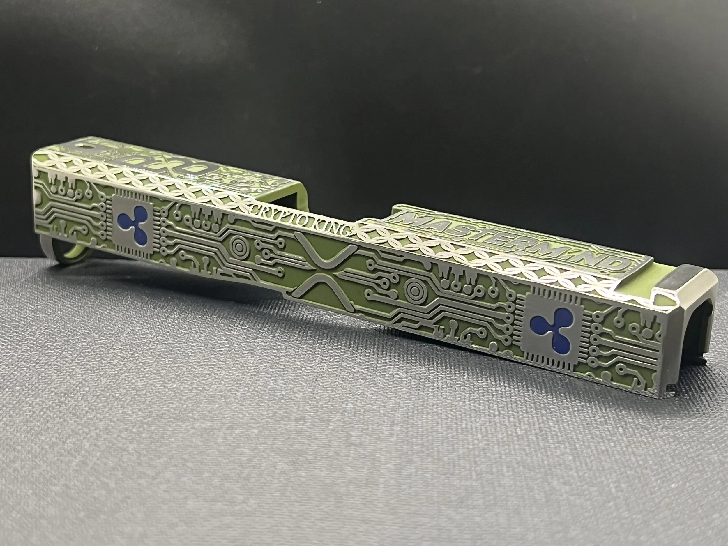 Custom Glock® 17 Gen 5, Ripple XRP themed, slide with circuit-style engraving and green Cerakote finish, designed, laser engraved, and custom finished for a client project.