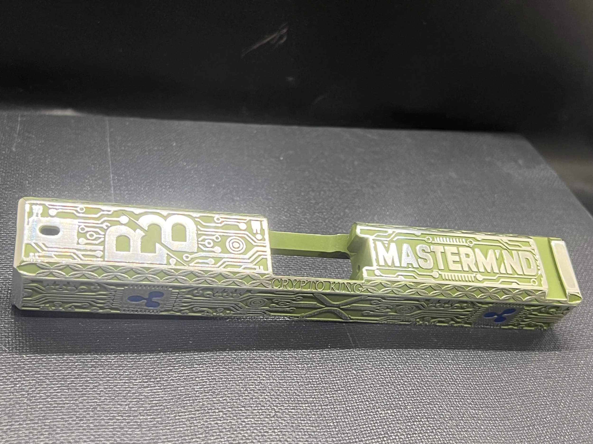 Custom Glock® 17 Gen 5, Ripple XRP themed, slide with circuit-style engraving and green Cerakote finish, designed, laser engraved, and custom finished for a client project.