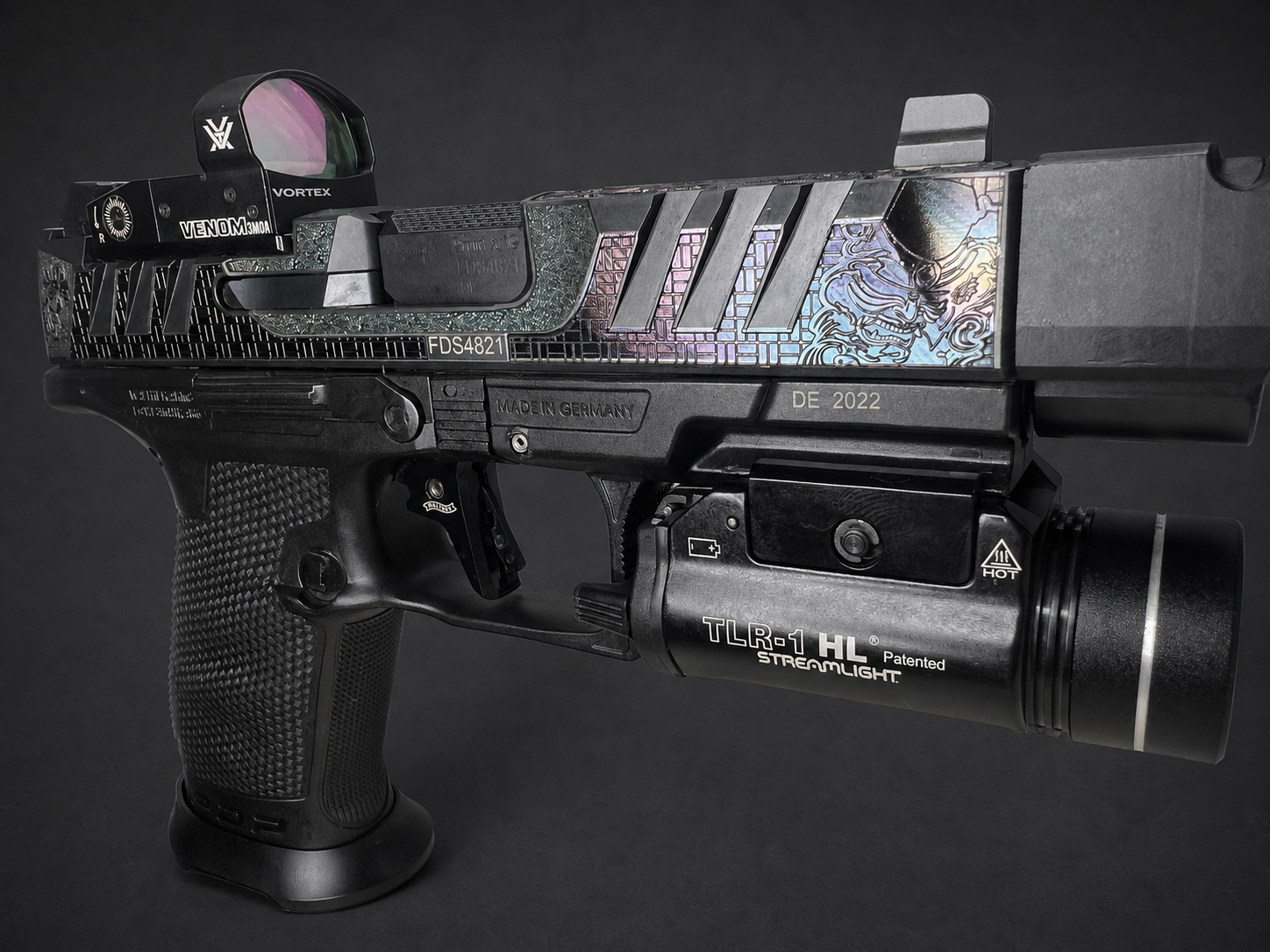 Full left-side view of custom engraved Walther PDP Pro with color-shifting slide artwork, optic, compensator and Streamlight