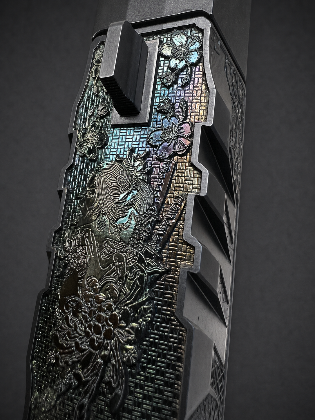 Close overhead detail of engraved woman, flowers and layered geometric texture on custom Walther PDP Pro slide