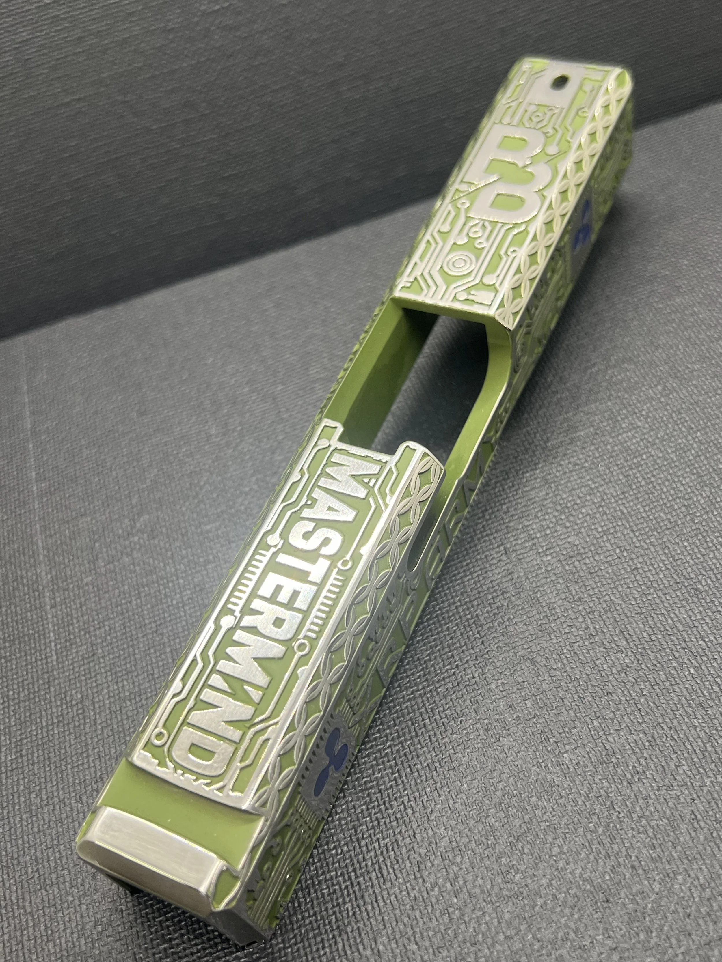 Custom Glock® 17 Gen 5, Ripple XRP themed, slide with circuit-style engraving and green Cerakote finish, designed, laser engraved, and custom finished for a client project.