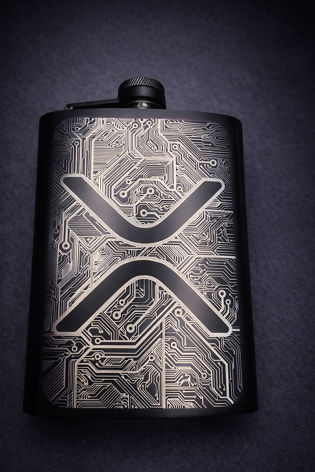 Black stainless steel hip flask displayed on dark background, available for custom laser engraving
