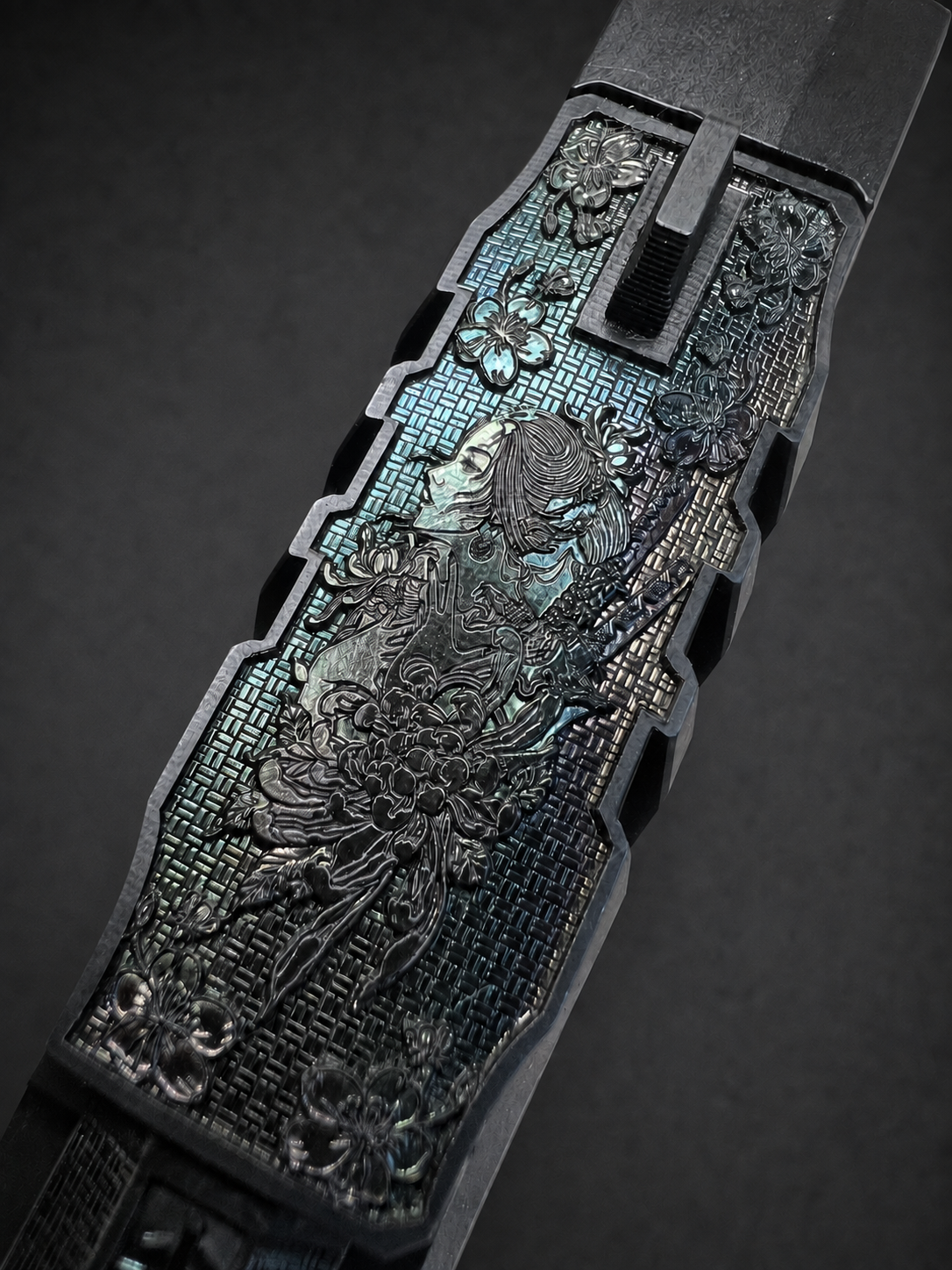 Angled top view of custom Walther PDP Pro slide showing Japanese-inspired figure, floral engraving and mosaic background
