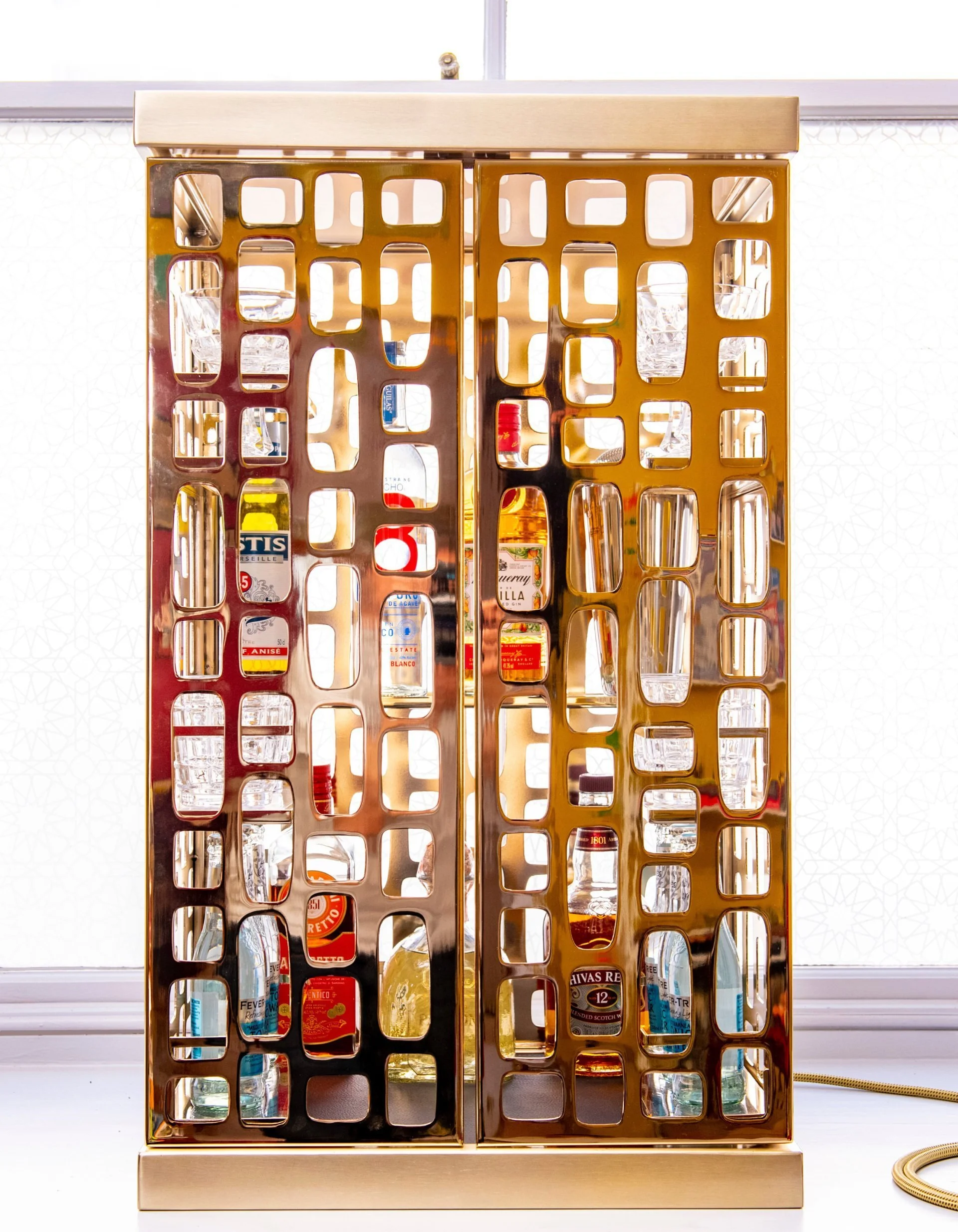 Vegas bar cabinet in rose gold plated steel, for Nobu Hotels.