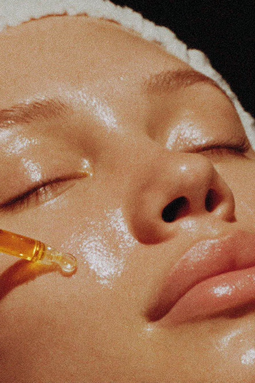 A close-up of a person's face with a dreamy expression, highlighted with a sparkling overlay and soft lighting.