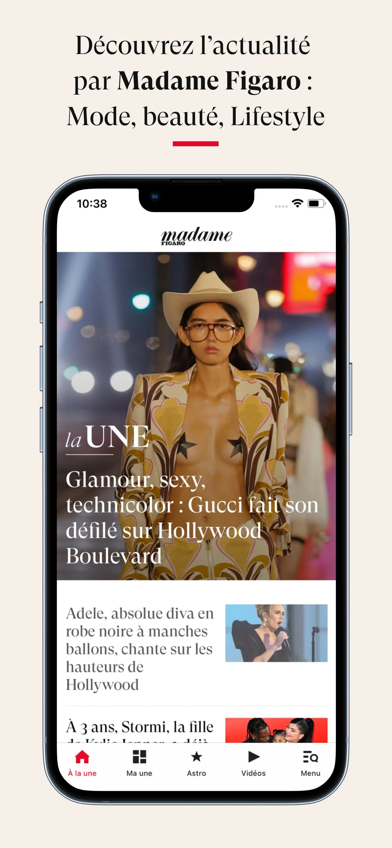 Capture d'écran d'un téléphone affichant un article de mode et de divertissement de Madame Figaro, avec une femme portant un chapeau de cowboy, une tenue à motifs, et un fond avec des lumières floues