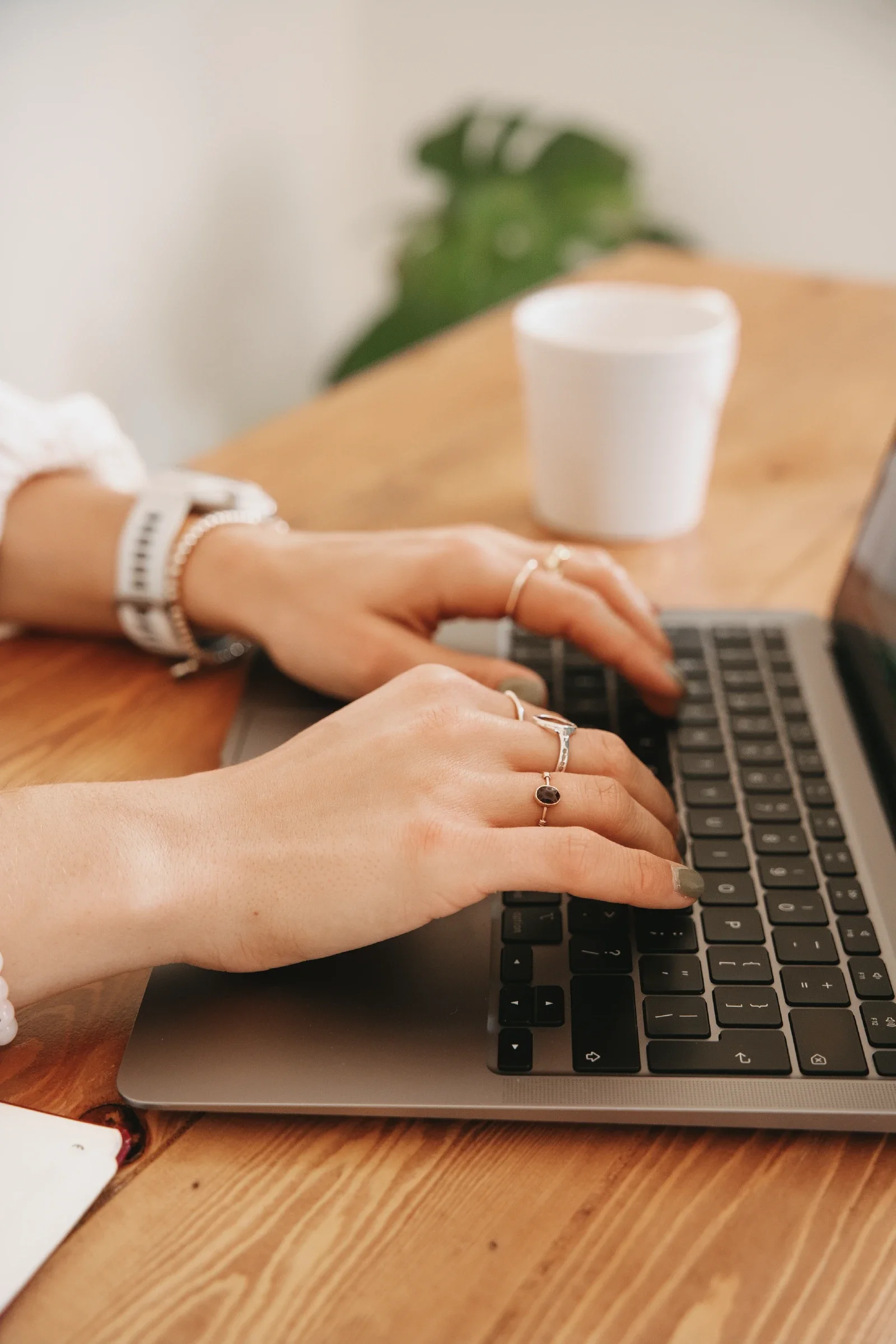 Close up of hands typing on laptop keyboar
