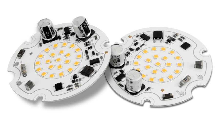 Close-up of two circular LED circuit boards with yellow LEDs, capacitors, and electronic components on a white background.
