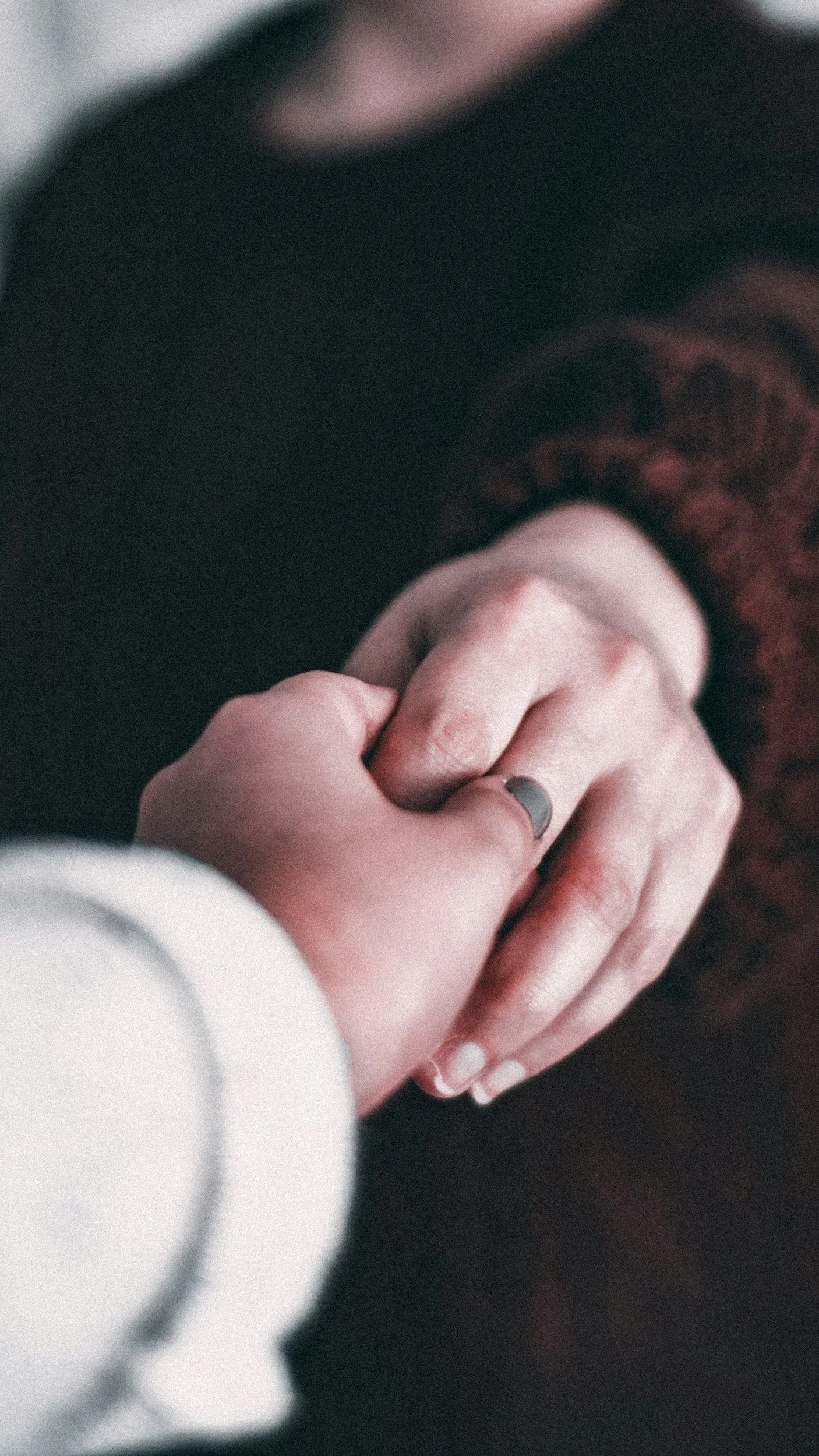 Close-up of a professional woman's hand setting a boundary in a notebook for burnout recovery.
