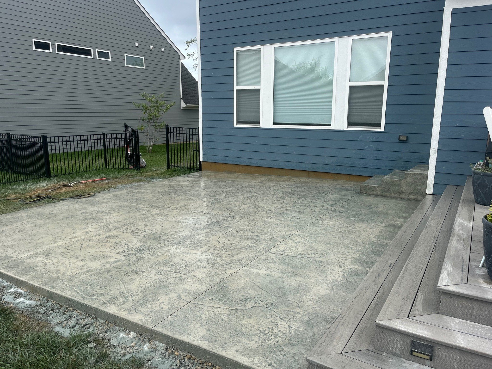 Custom colored concrete with blue antiquing