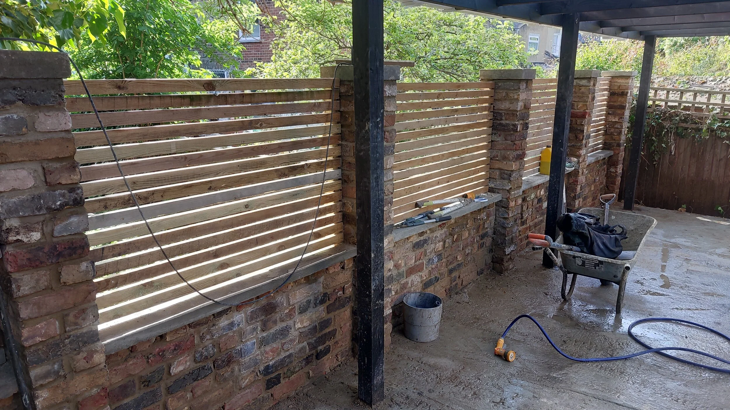 the batten is the old fence, so really, this whole wall was recycled. great way to save on money and materials
