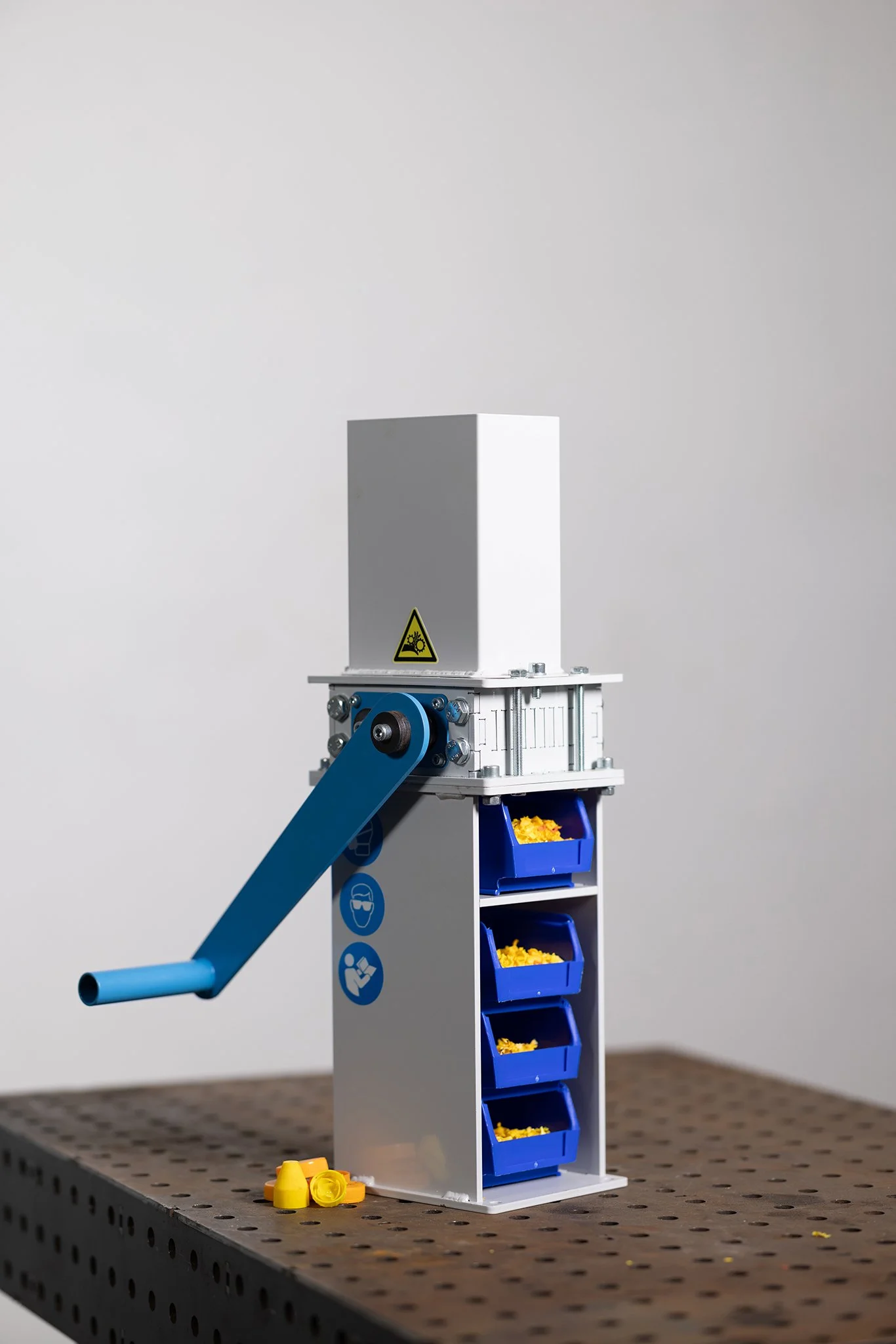 Picture of the Mini Shredder machine, a small scale manual shredder designed and produced by Mad Plastic.