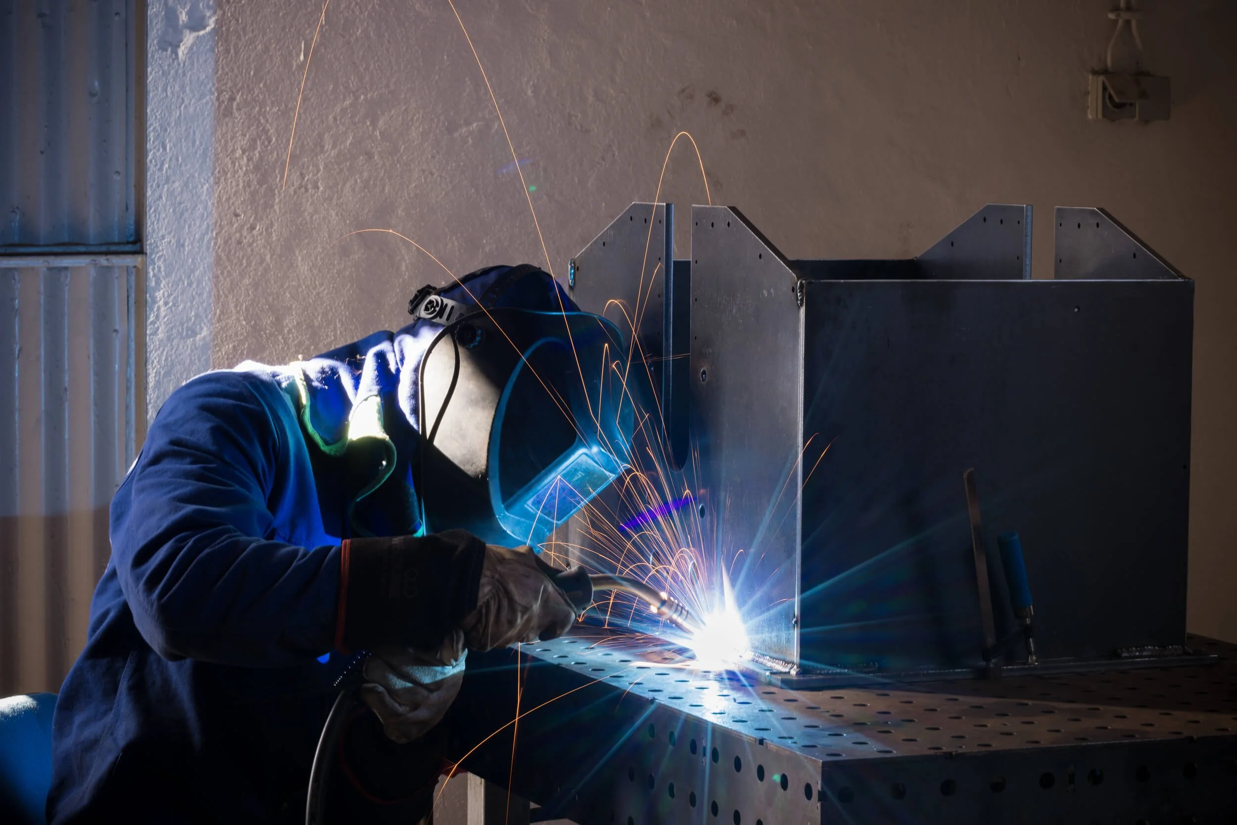 Welding the shredder pro machine together.